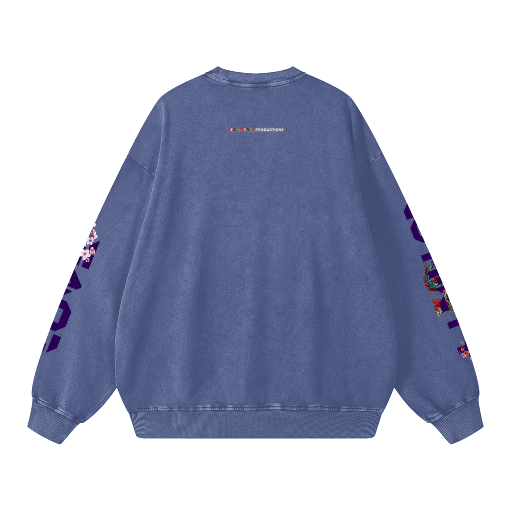 Blue sweatshirt with colorful designs on sleeves and back on a white background
