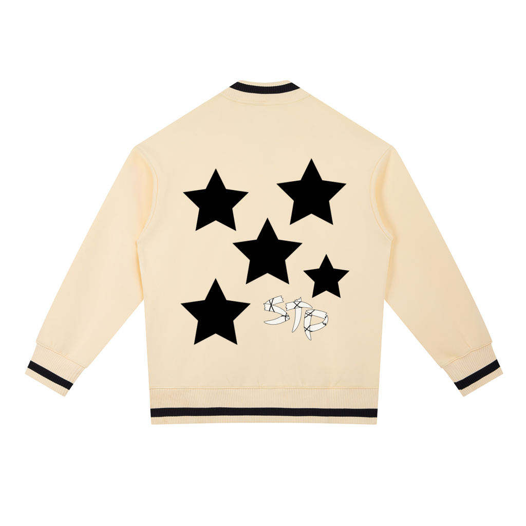 Beige sweatshirt with black star designs on a white background