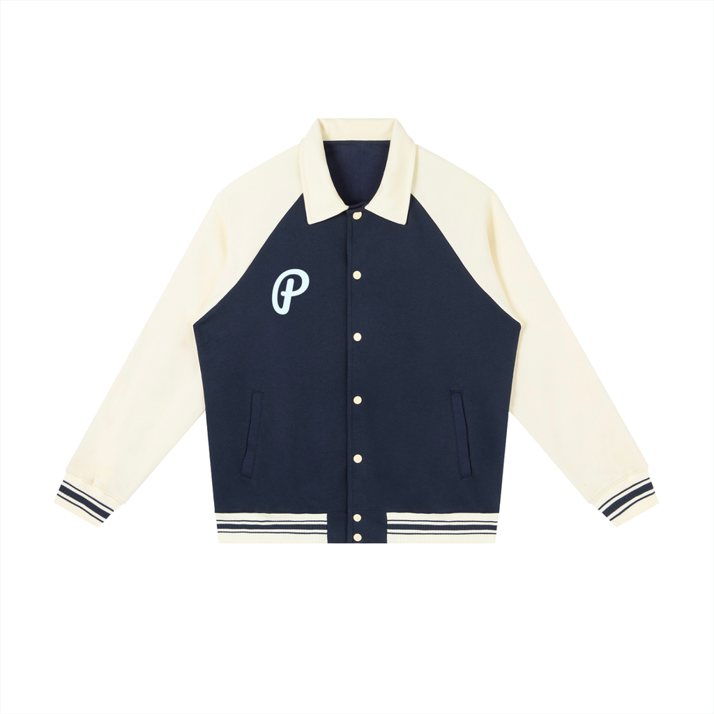 Navy and cream varsity jacket with a logo on a white background