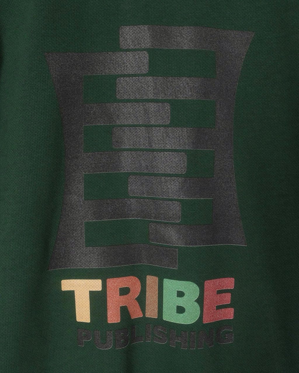 Green track jacket with 'TRIBE' logo and text on a dark green background