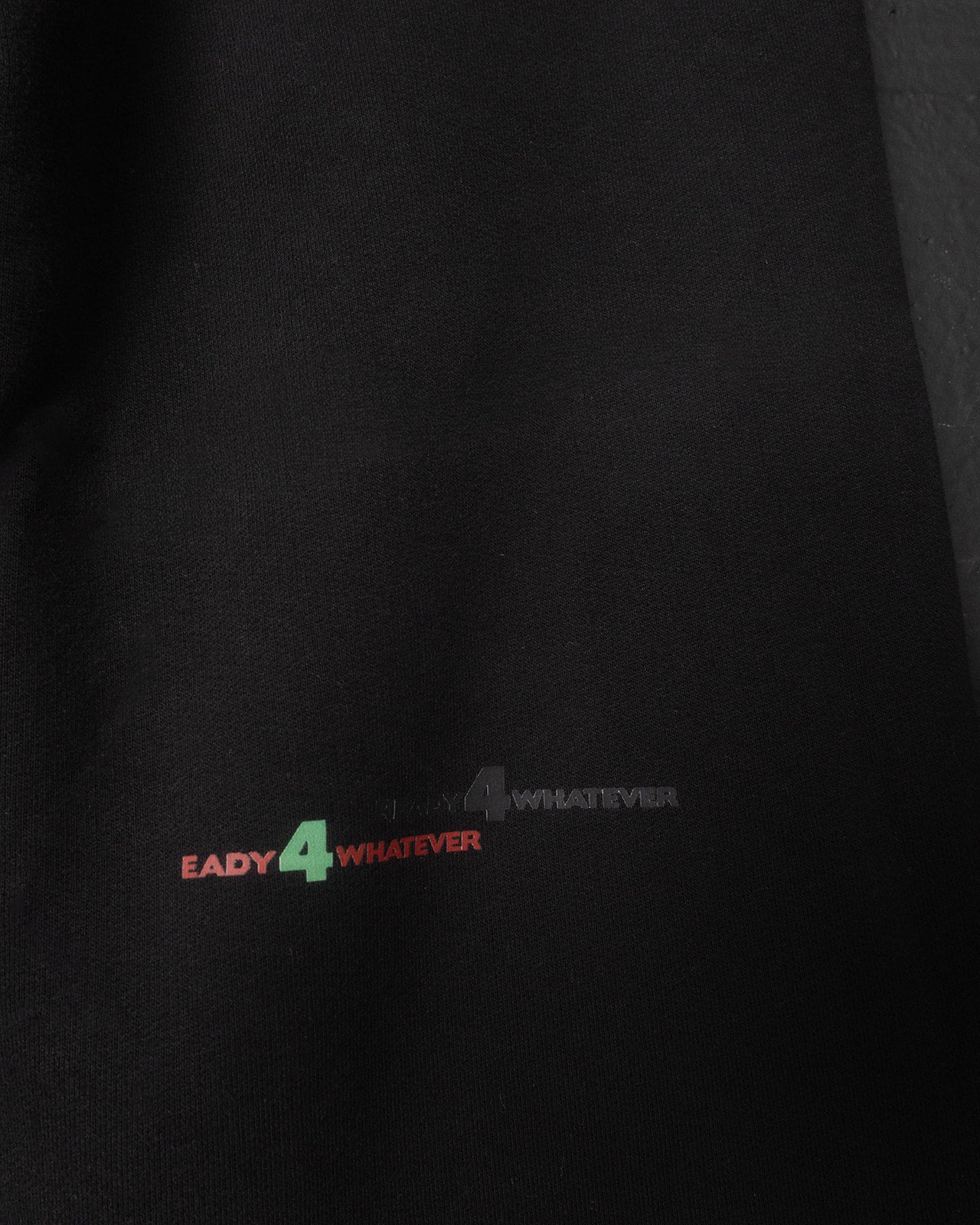Black shirt with 'Ready 4 Whatever' text in multicolor on a dark background