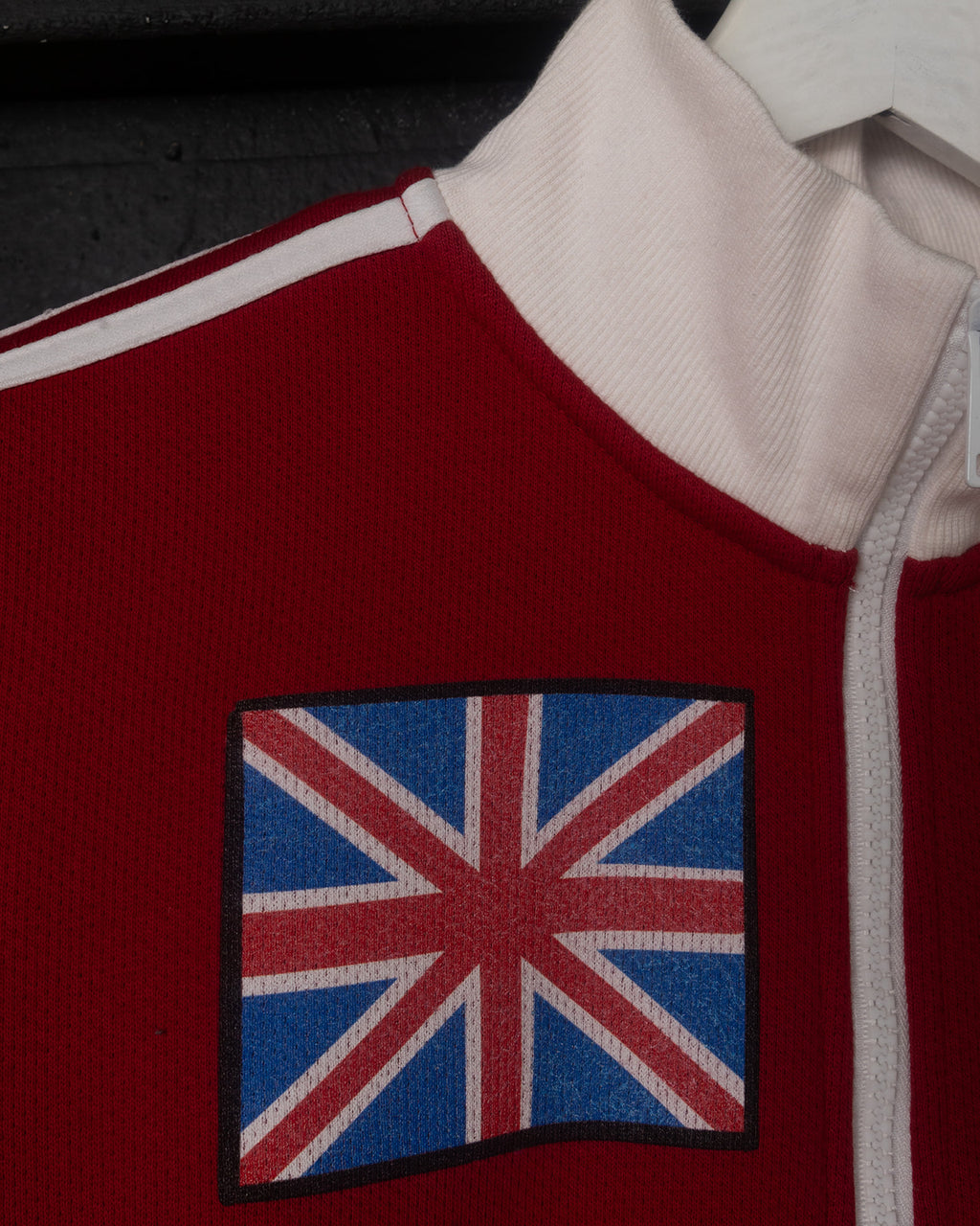 Red jacket with a patch on a black background