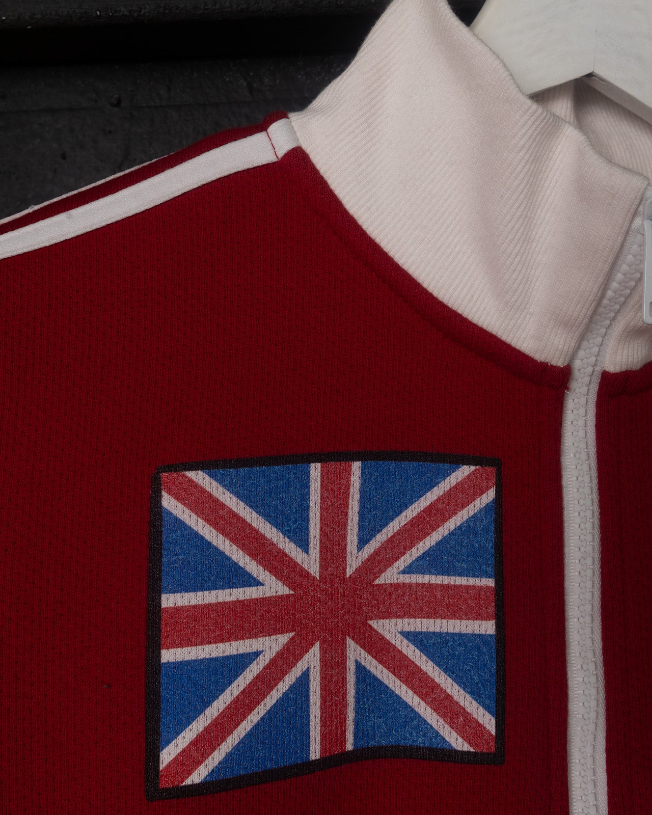 Red jacket with a patch on a black background