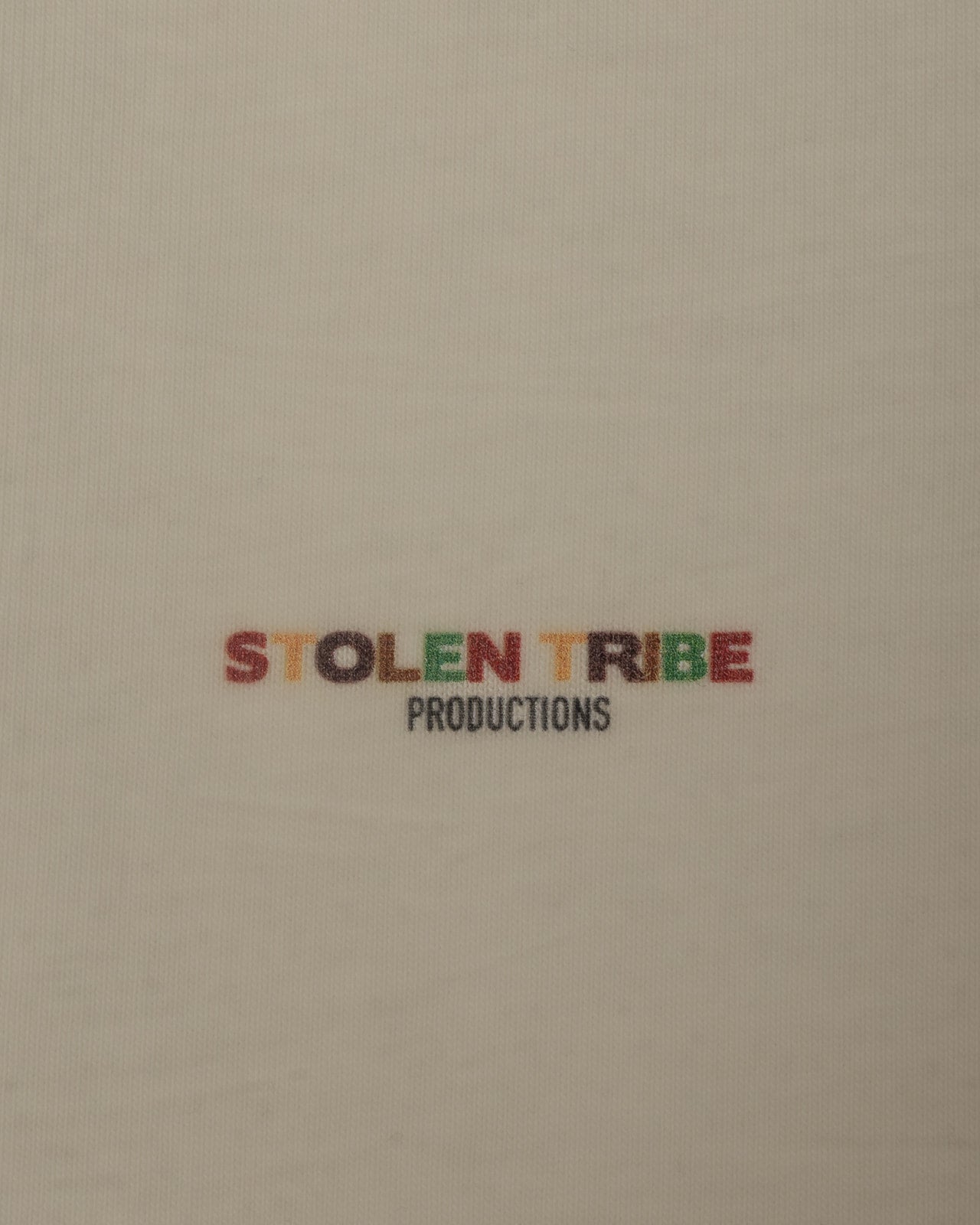 Text 'STOLEN TRIBE PRODUCTIONS' on a beige background