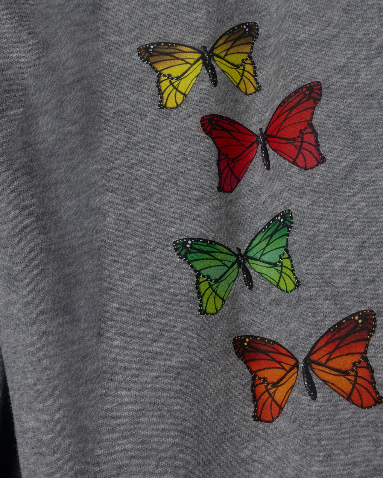 Colorful butterflies on a gray fabric background