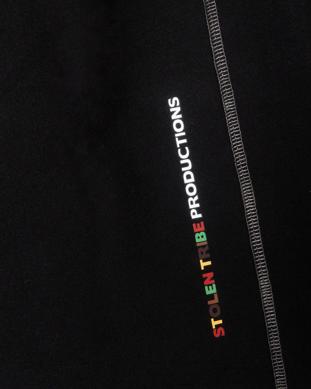 Black Sweatpants with 'Stolen Tribe Productions' logo on a black background