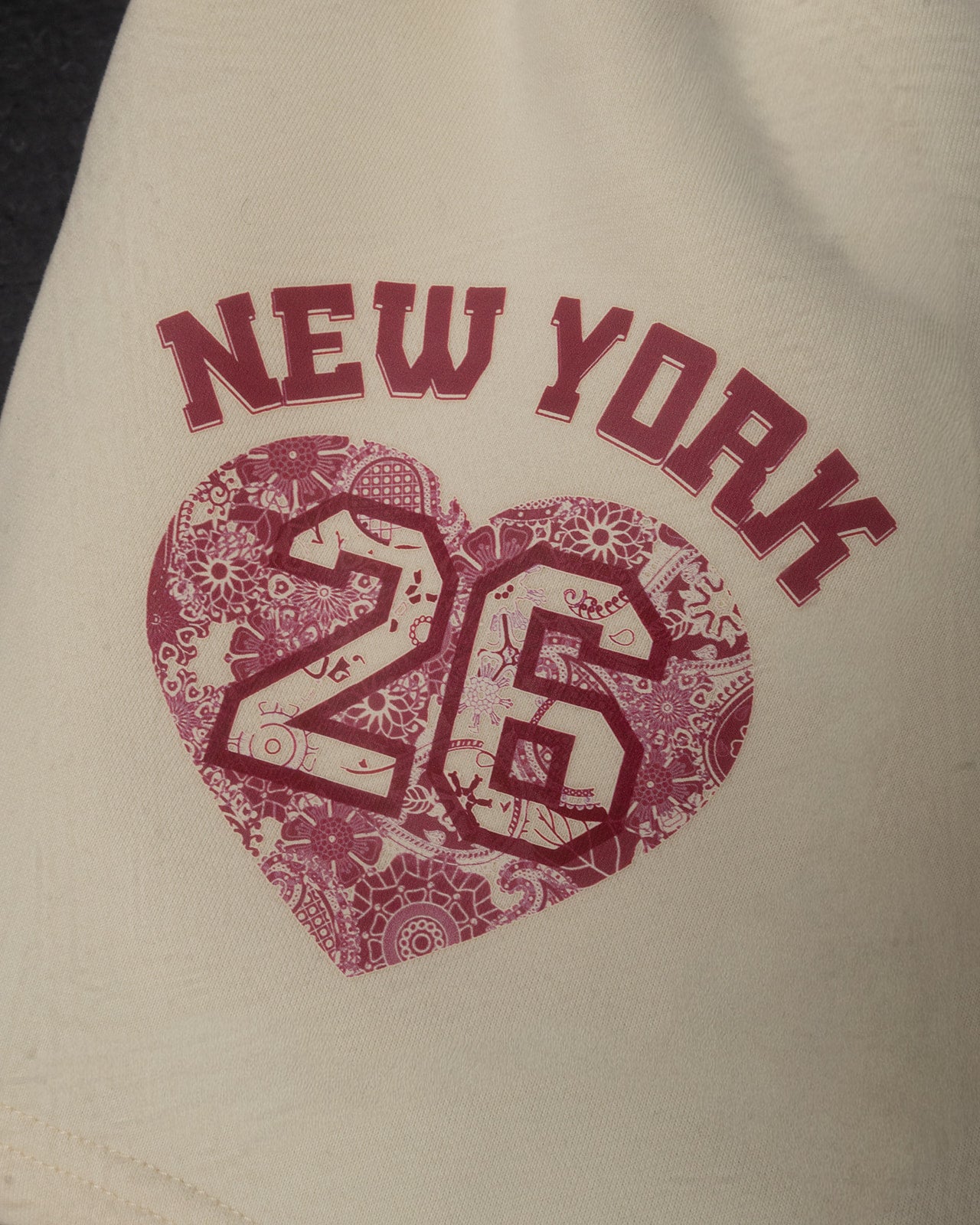 Beige bag with 'New York 26' printed in red with a heart design.