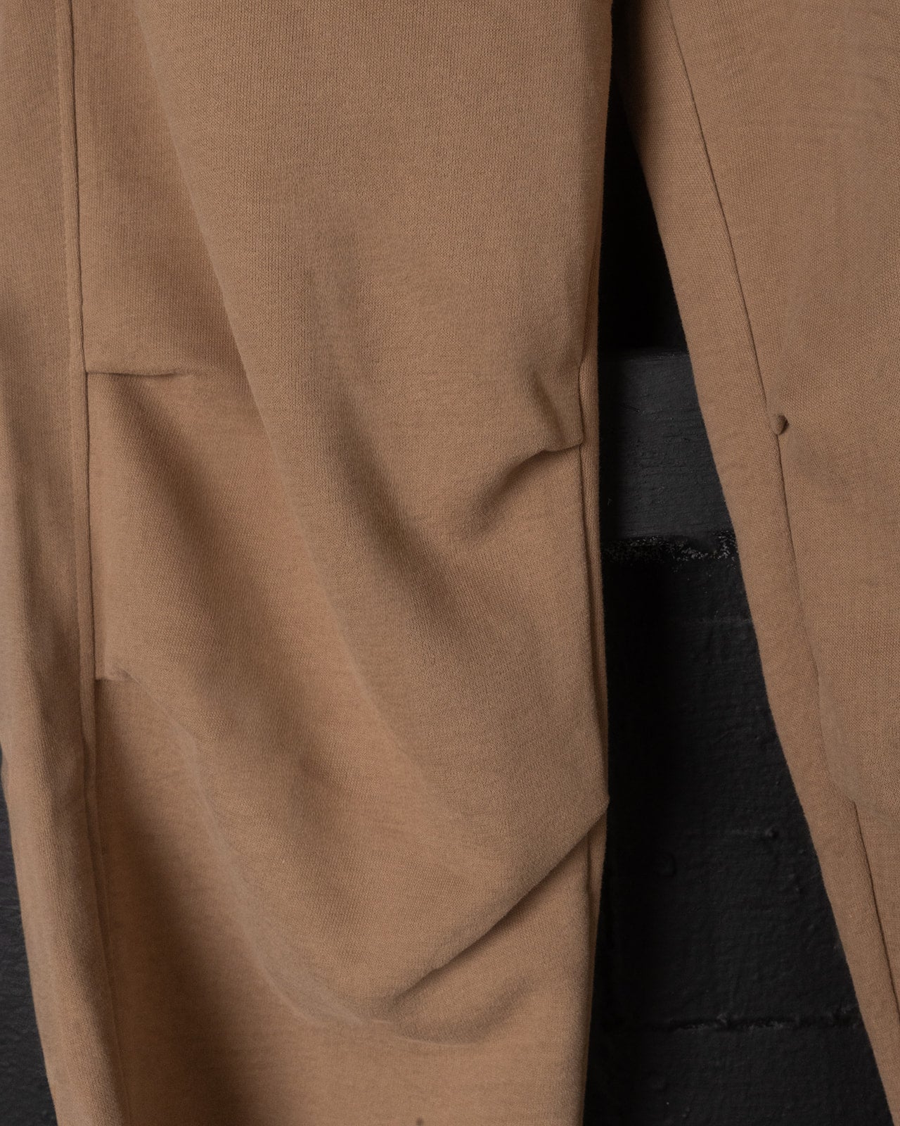 Close-up of a brown pants with a dark background