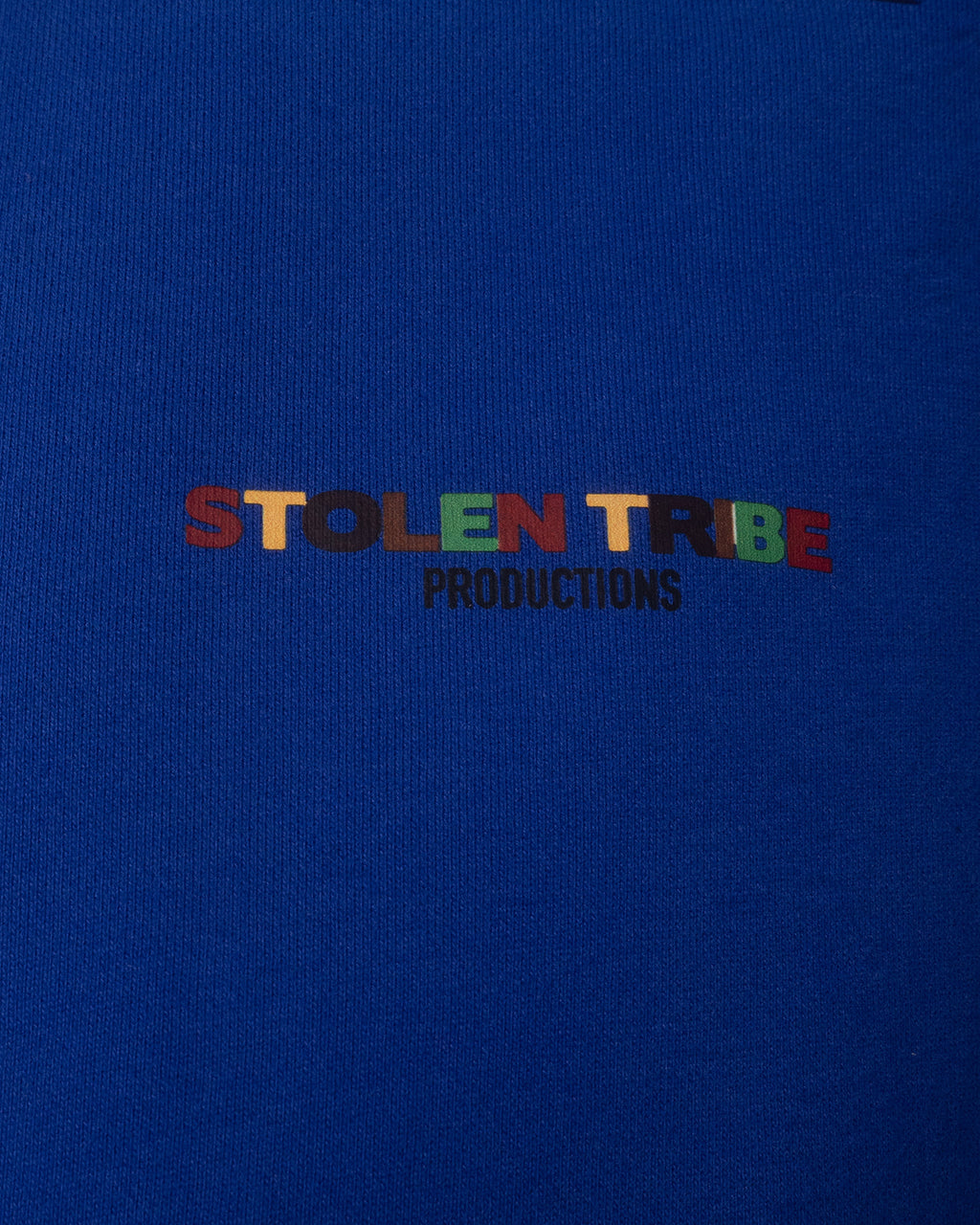 Colorful 'STOLEN TRIBE PRODUCTIONS' text on a blue background