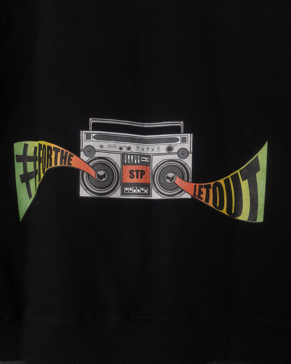 Black sweatshirt with a graphic of a boombox and text on a dark background