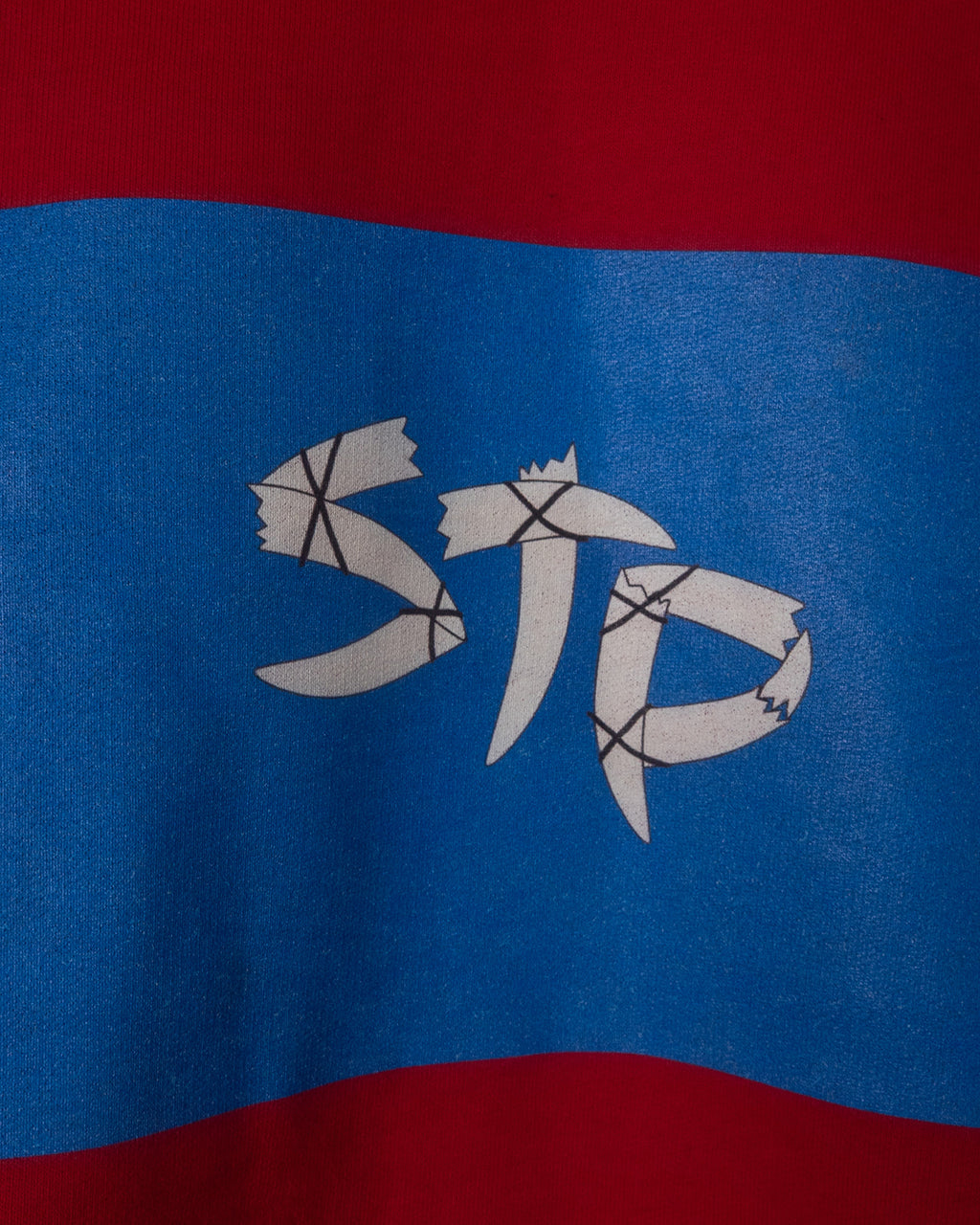 Close-up of a logo on a red and blue background