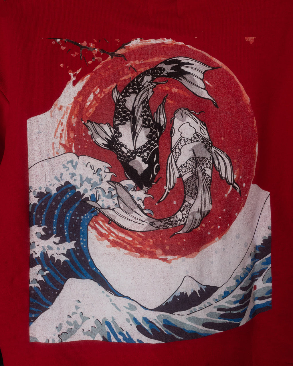 Red shirt with a design of two koi fish in water and a red circle in the background.