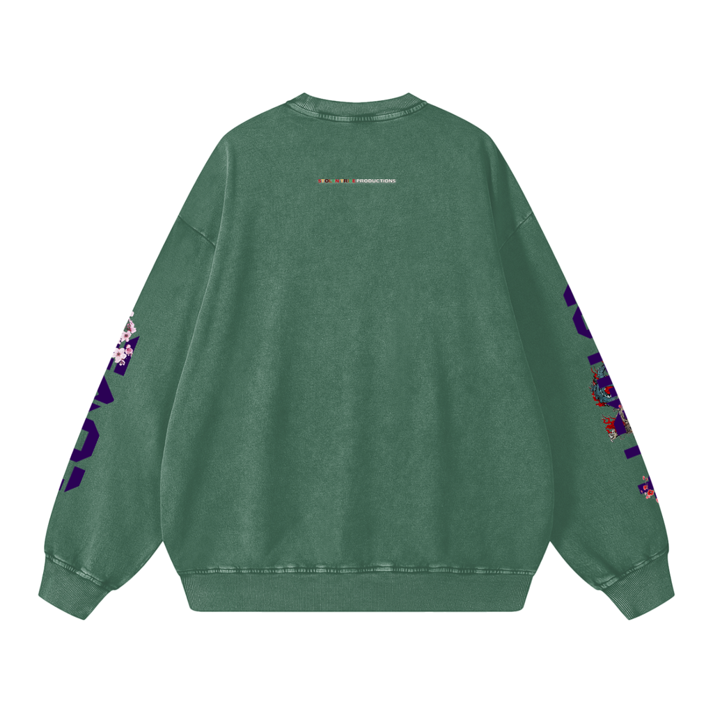 Green sweatshirt with floral patterns on sleeves against a white background