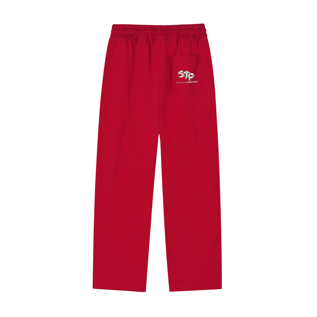 Red pants with a logo on the pocket against a white background