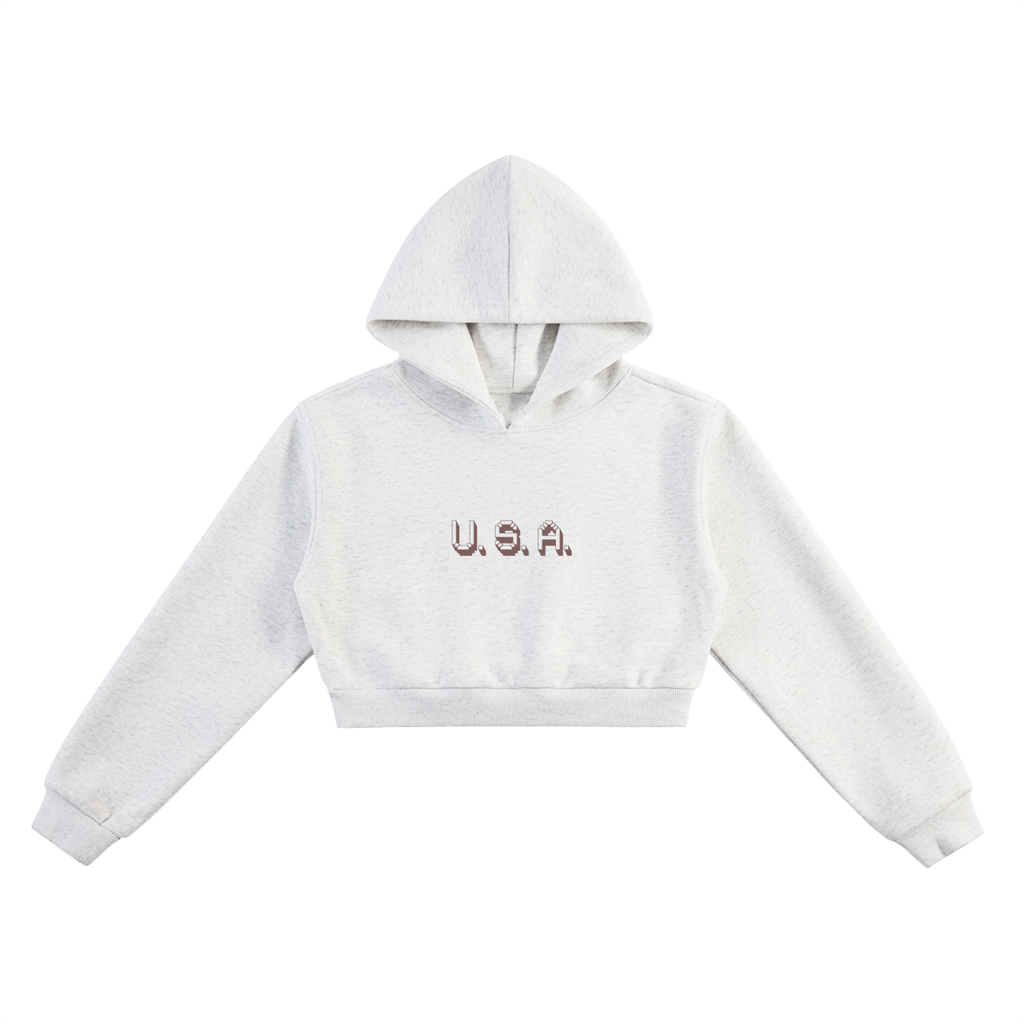White cropped hoodie with 'U.S.A.' text on a white background