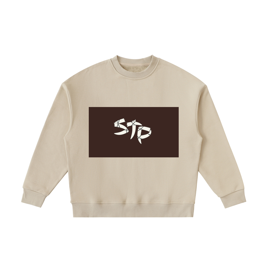Beige sweatshirt with a brown rectangle featuring white text on a white background