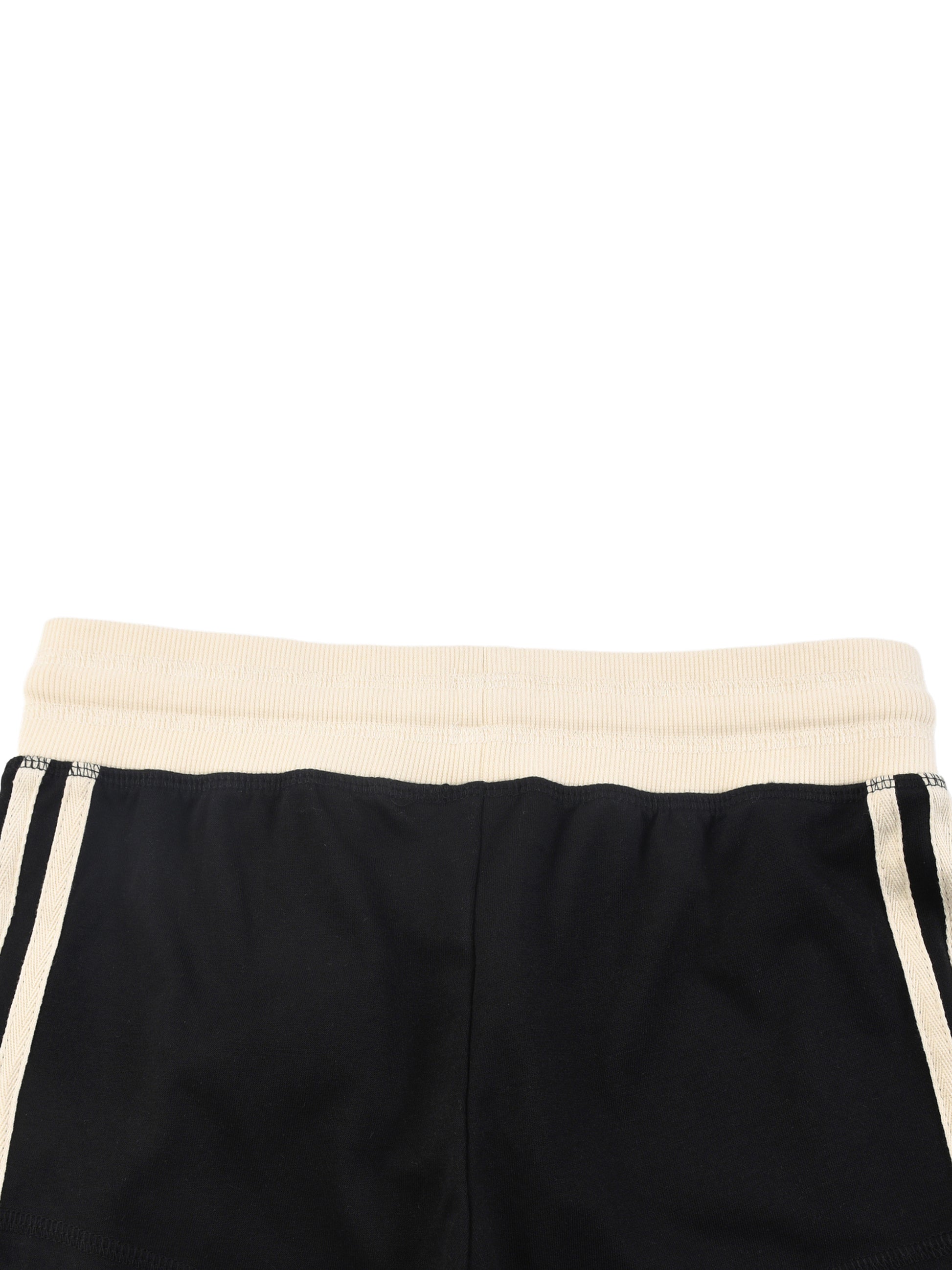 Black shorts with a cream waistband on a white background