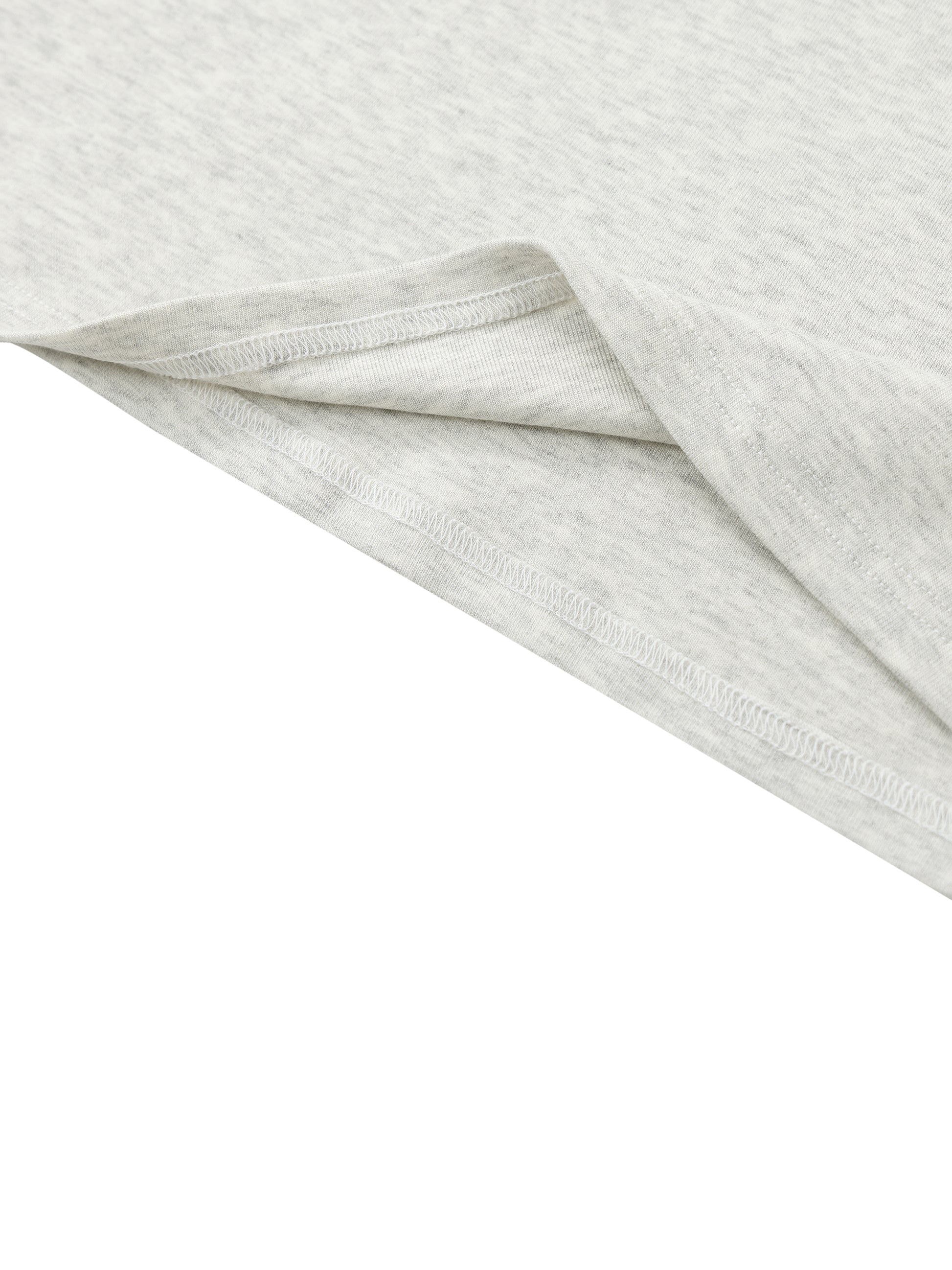 Close-up of light gray fabric with a subtle pattern on a white background