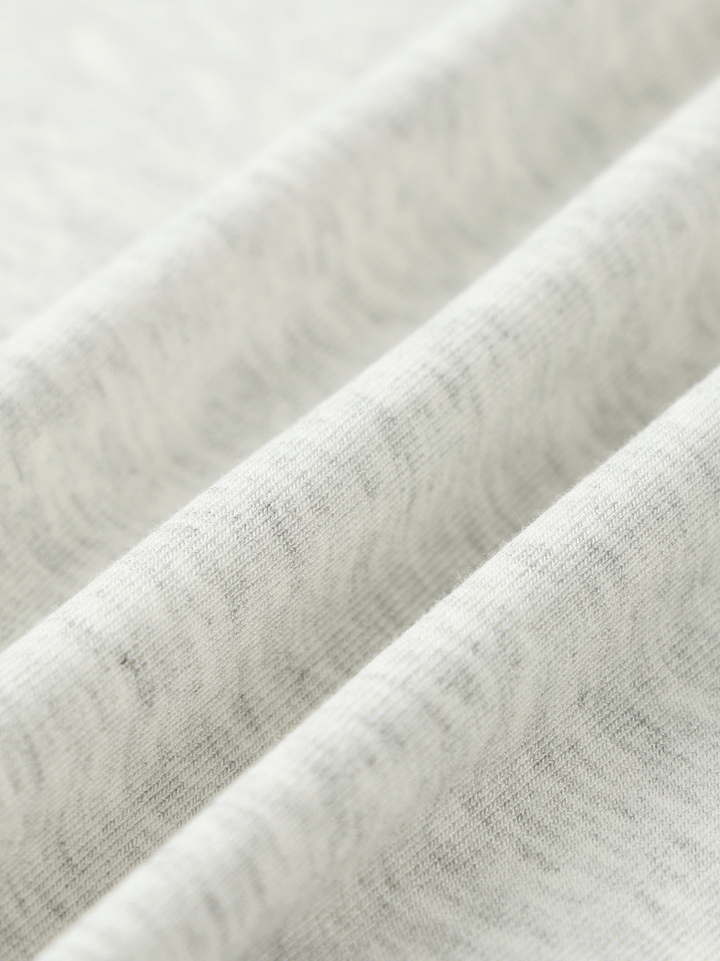 Close-up of textured gray fabric with a subtle pattern