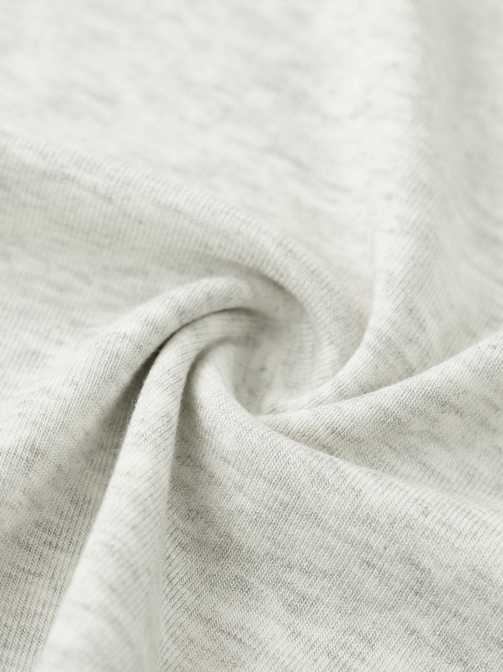 Close-up of light gray fabric with a subtle texture