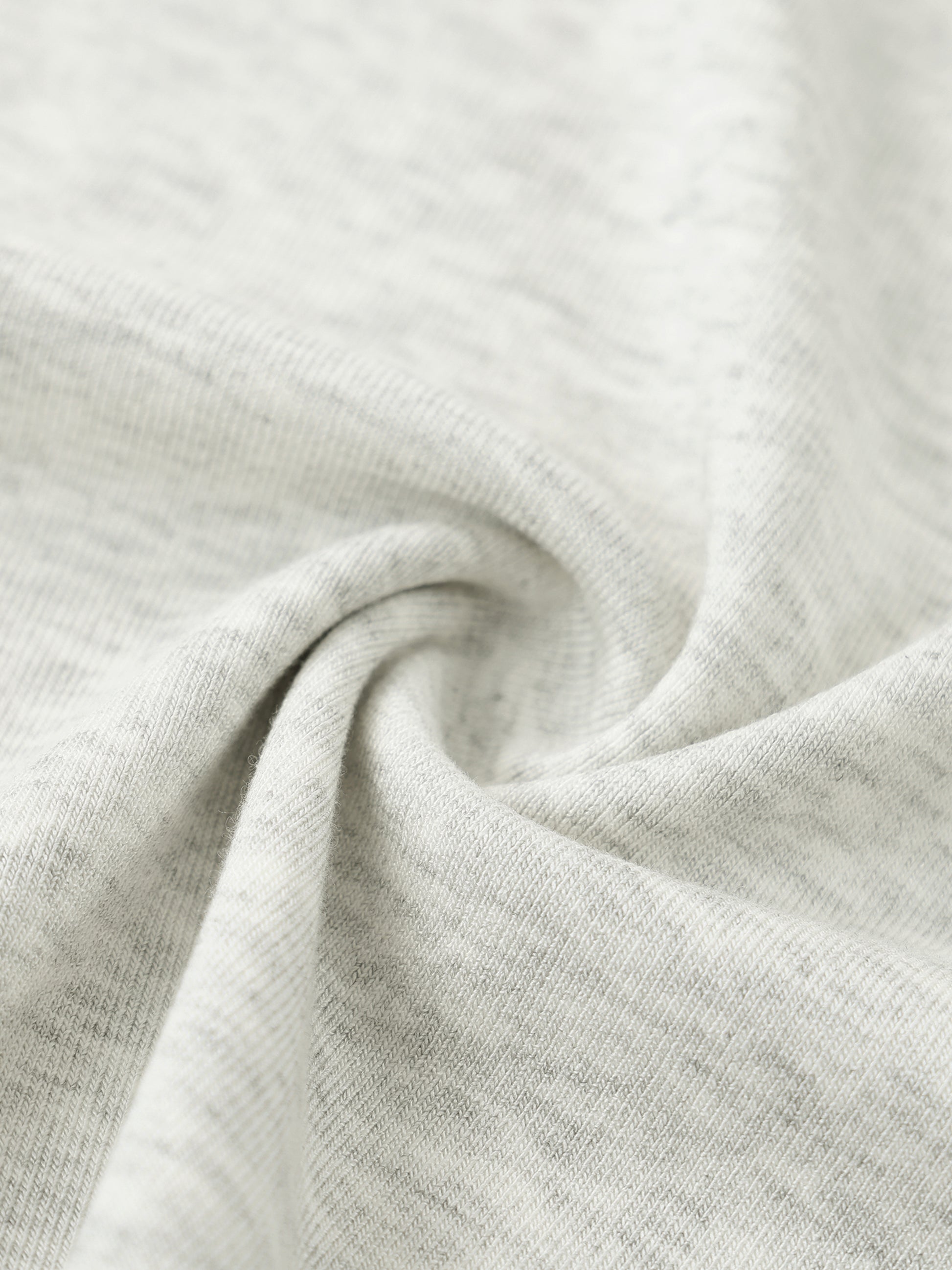Close-up of light gray fabric with a subtle texture