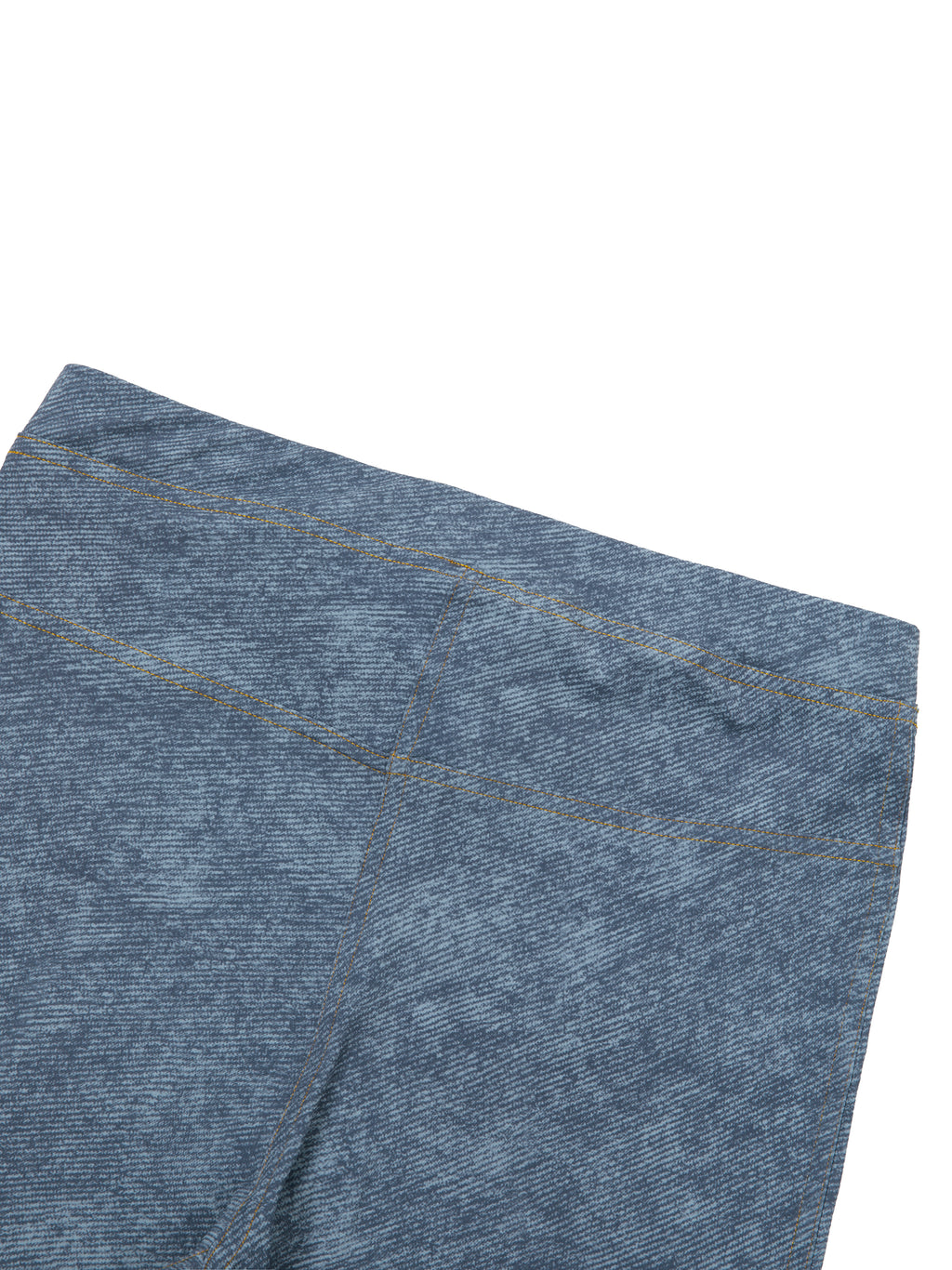 Close-up of blue denim fabric on a white background
