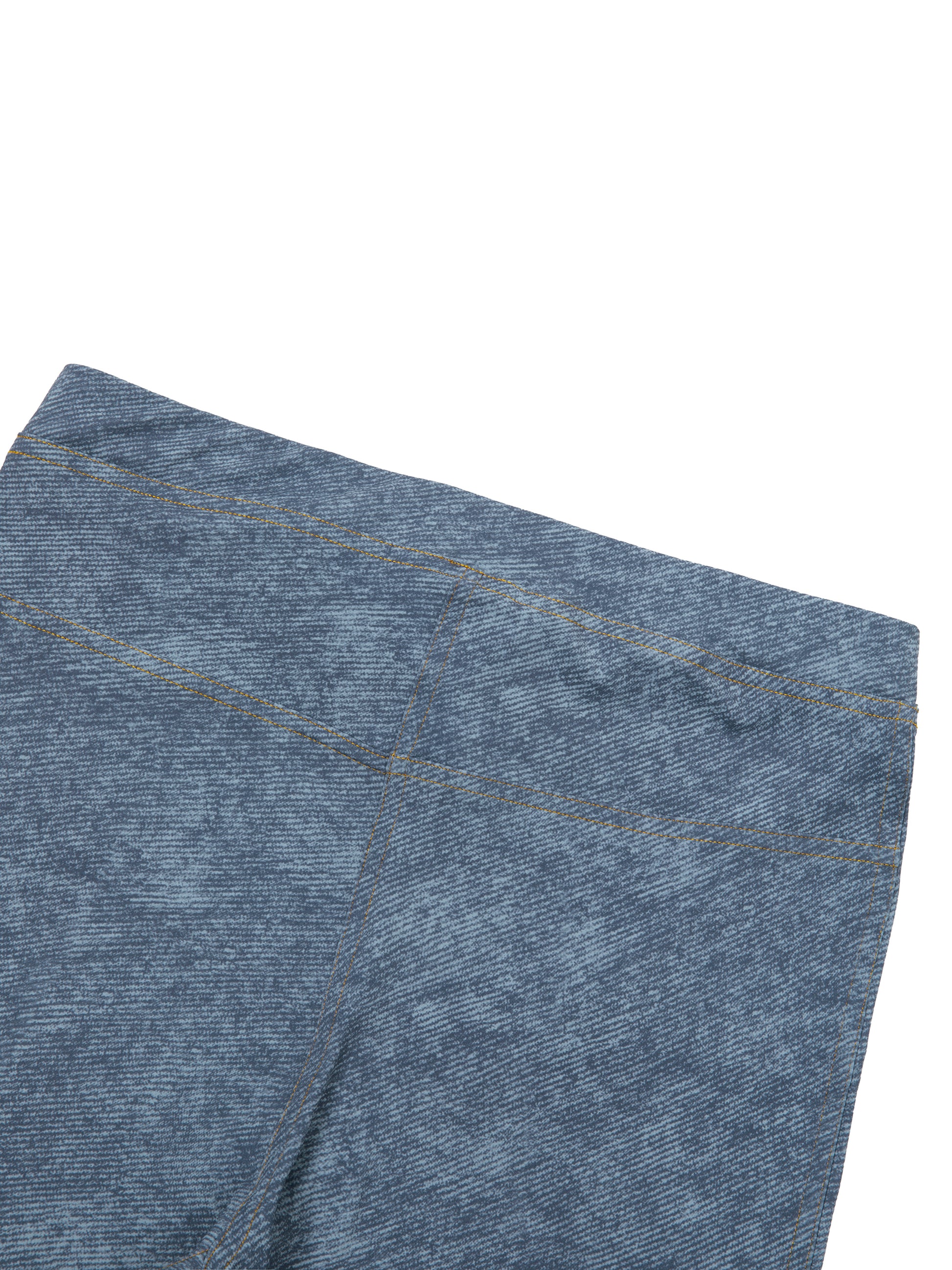 Close-up of blue denim fabric on a white background
