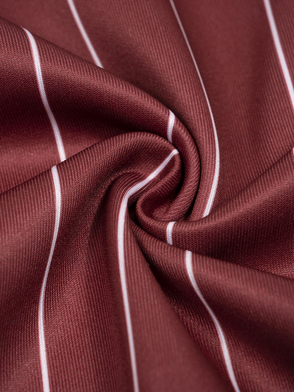 Close-up of maroon fabric with white stripes
