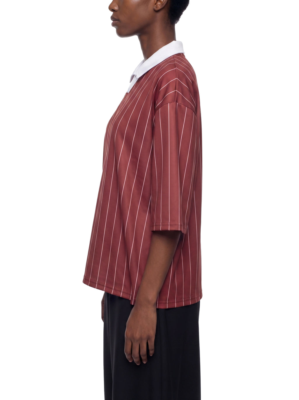 Person wearing a red and white striped shirt on a white background