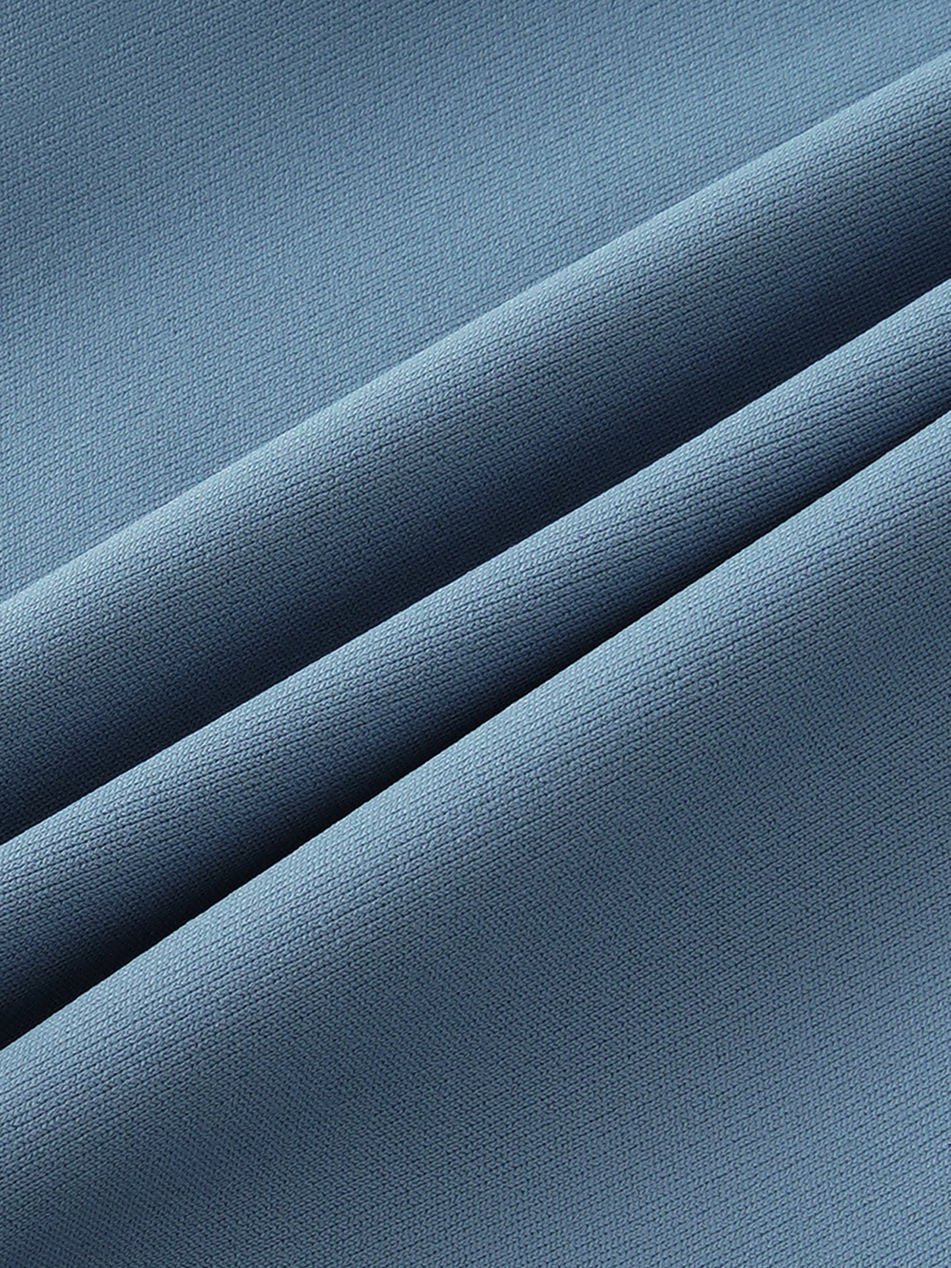 Close-up of blue fabric with a textured pattern