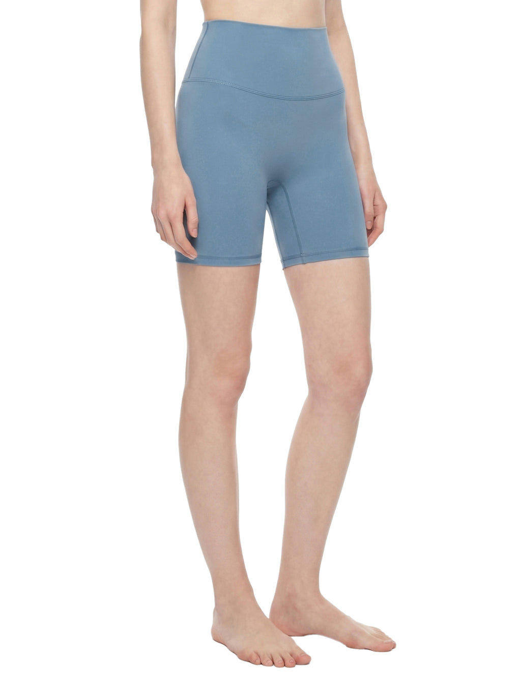 Person wearing light blue shorts on a white background