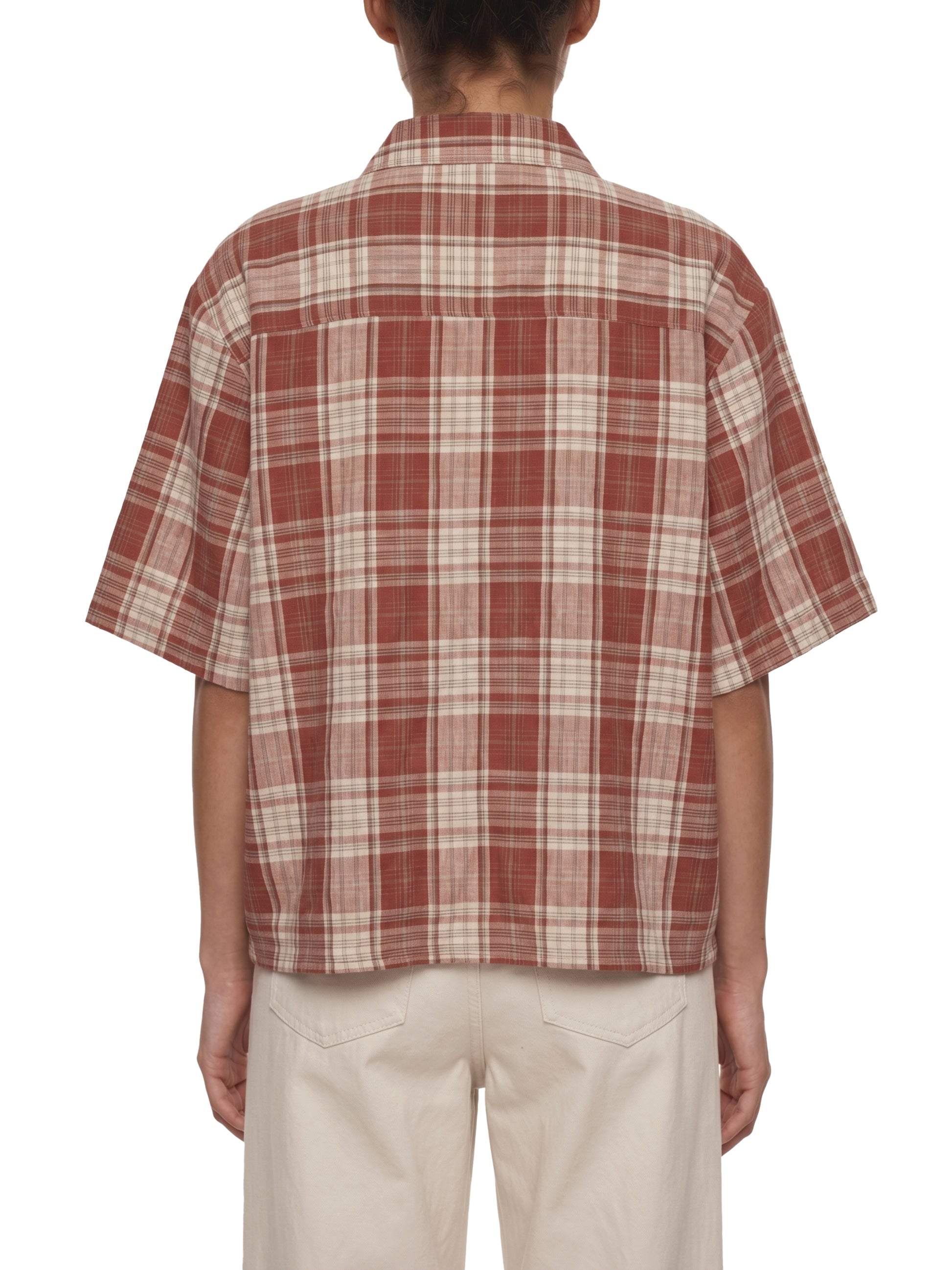Person wearing a red and white plaid shirt on a white background