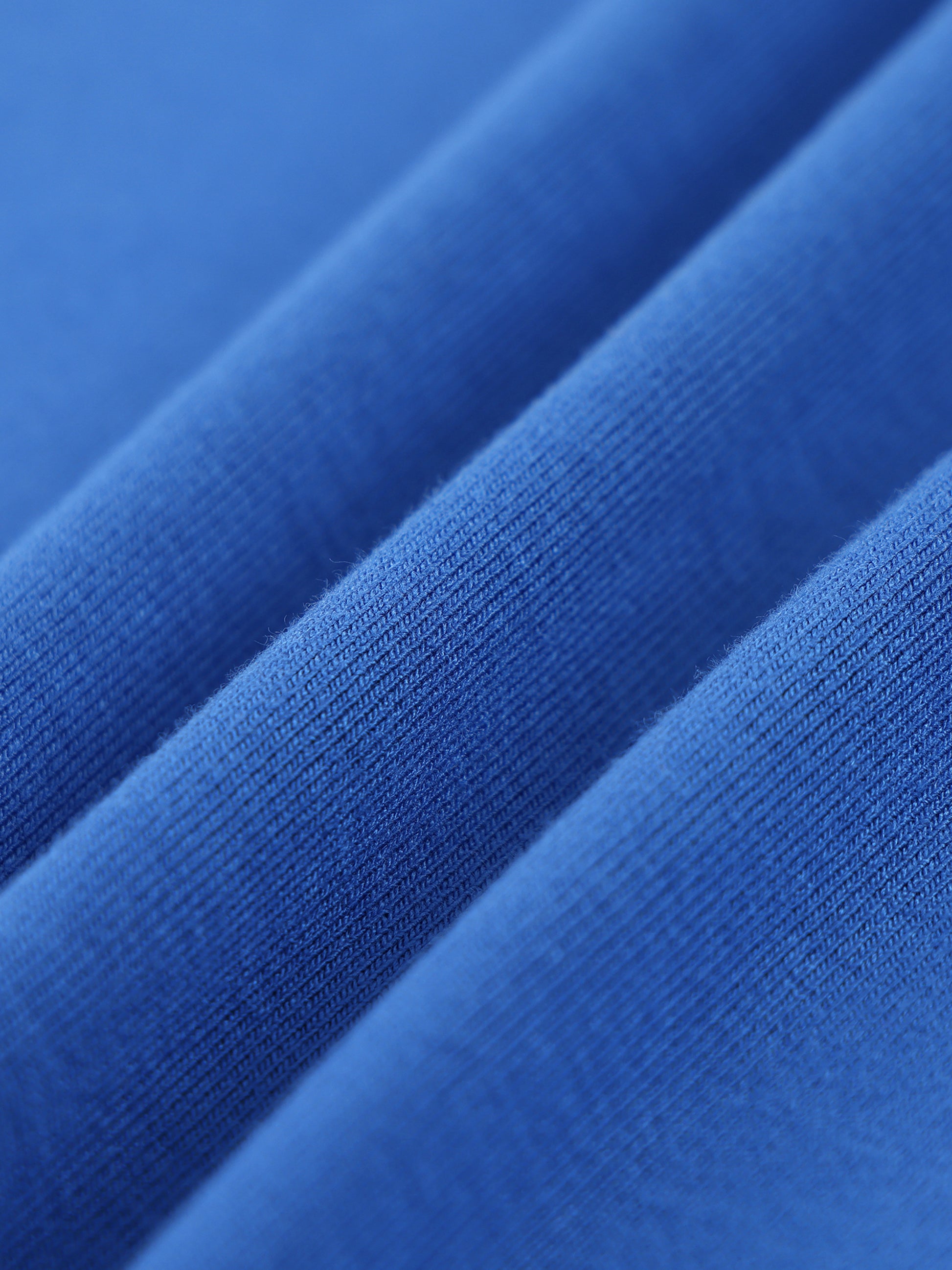 Close-up of blue fabric with a textured pattern