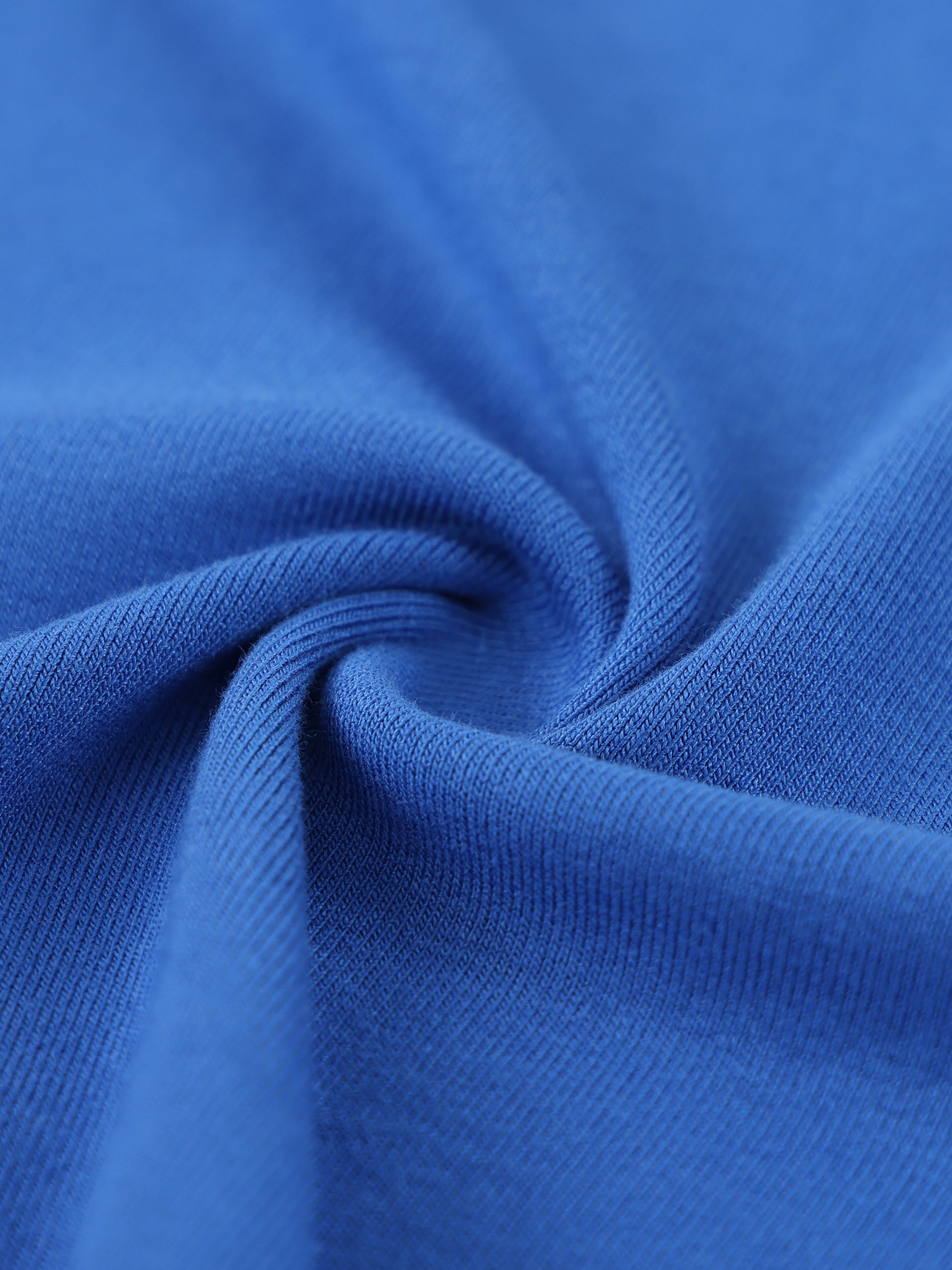 Close-up of blue fabric with a swirl pattern