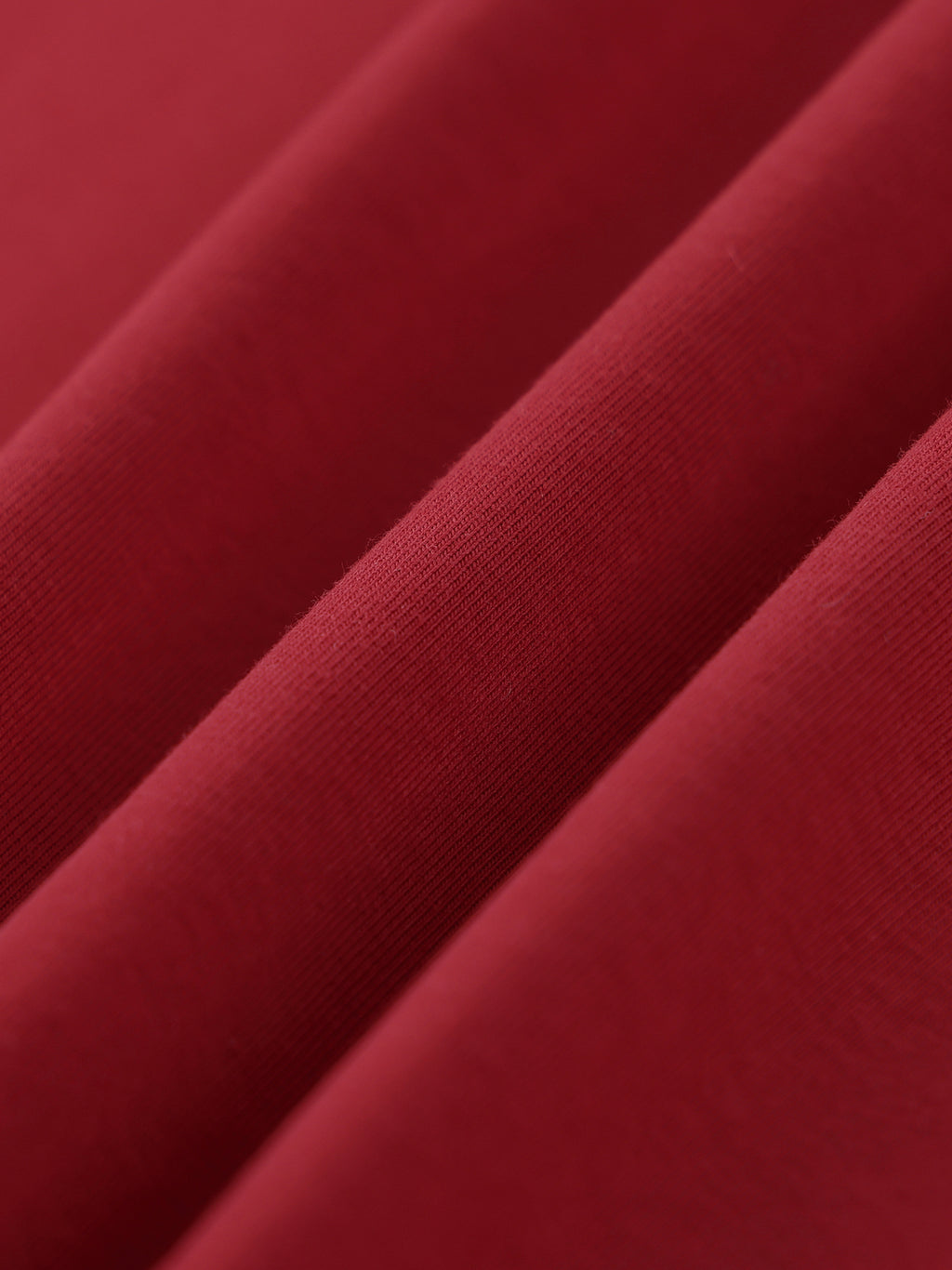 Close-up of red fabric with a subtle texture