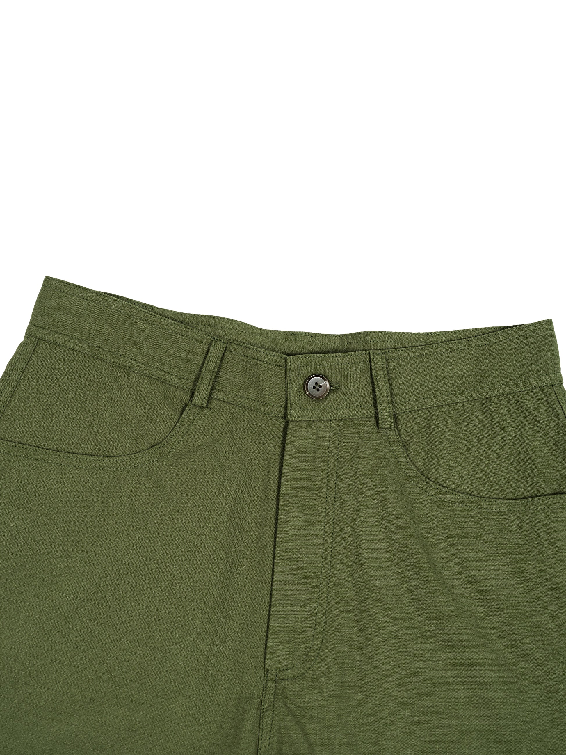 Close-up of green pants with a button on a white background