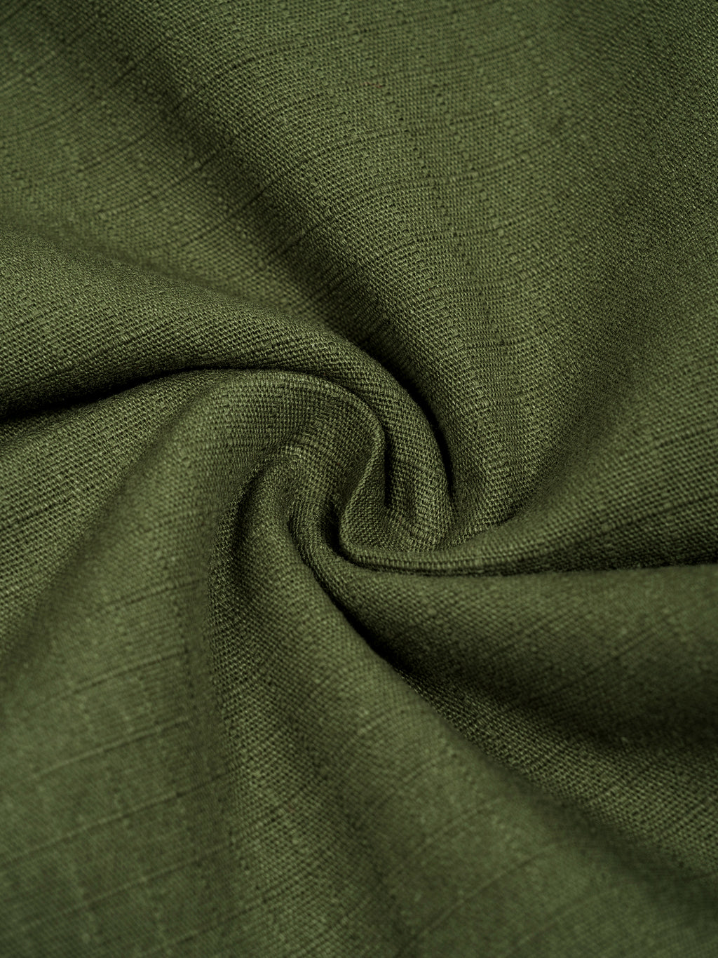 Close-up of green fabric with a textured pattern
