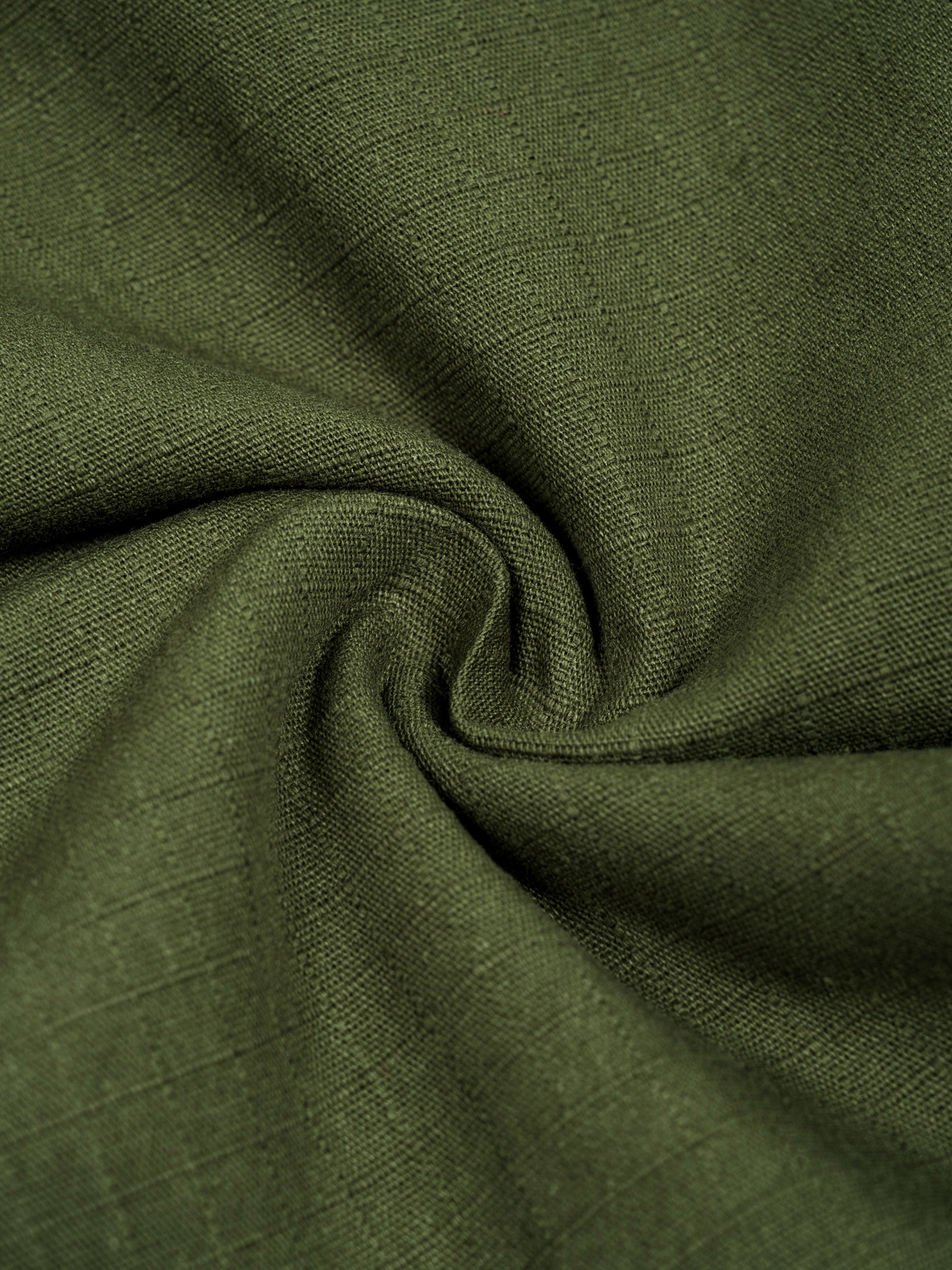 Close-up of green fabric with a textured pattern