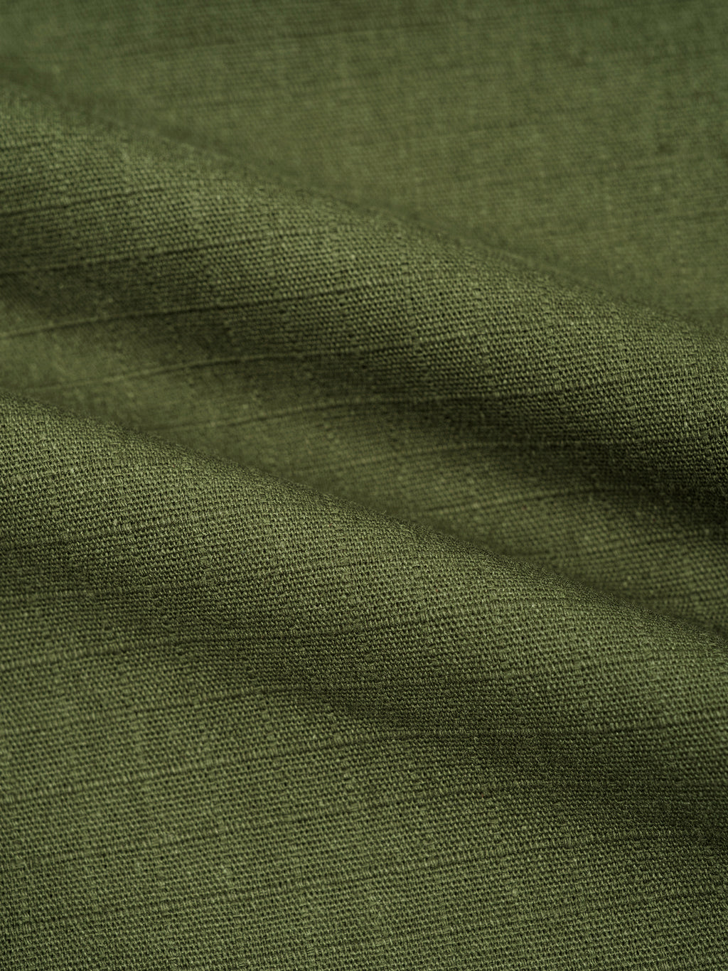 Close-up of green fabric with visible texture