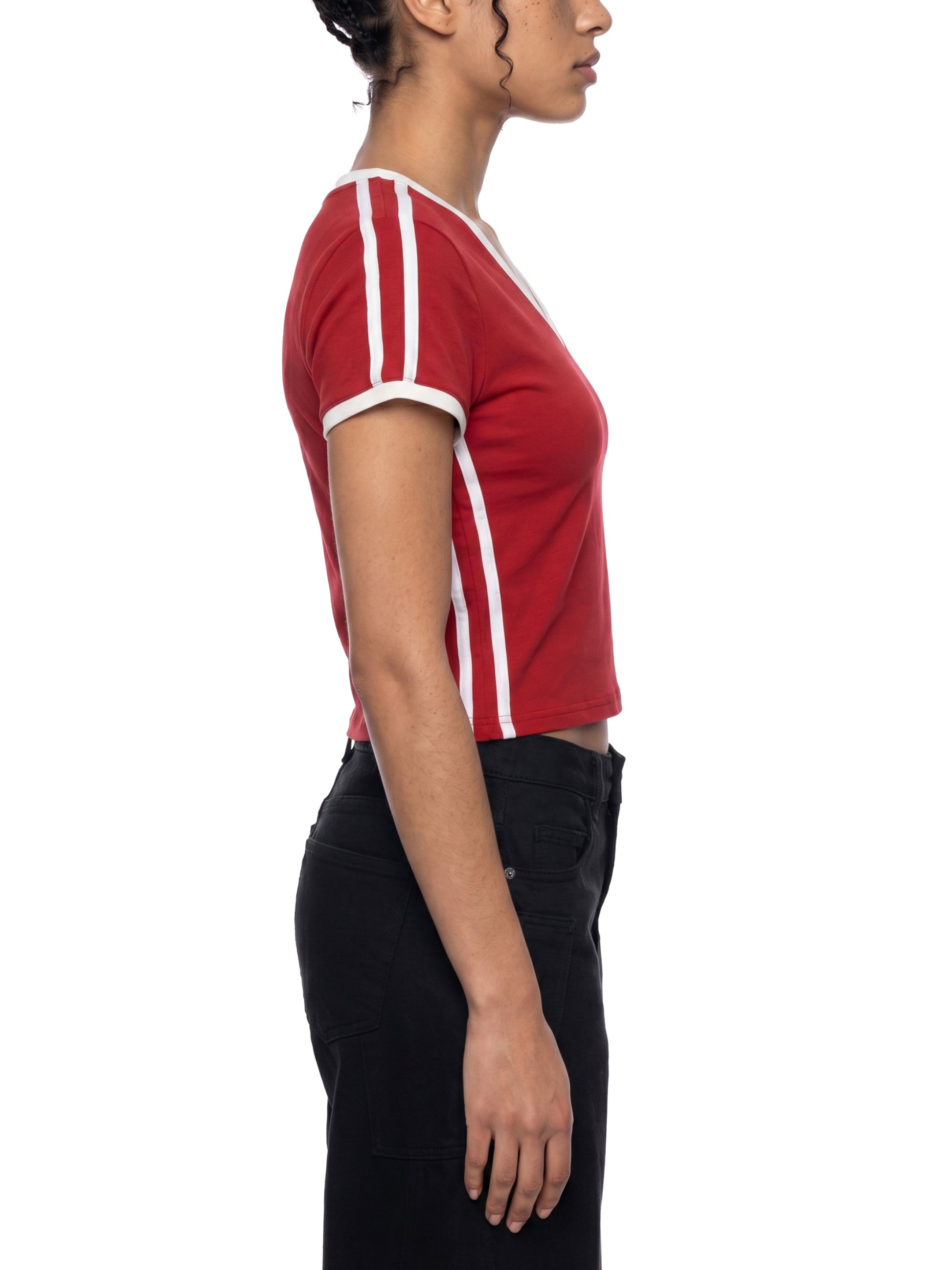 Person wearing a red and white striped shirt on a white background