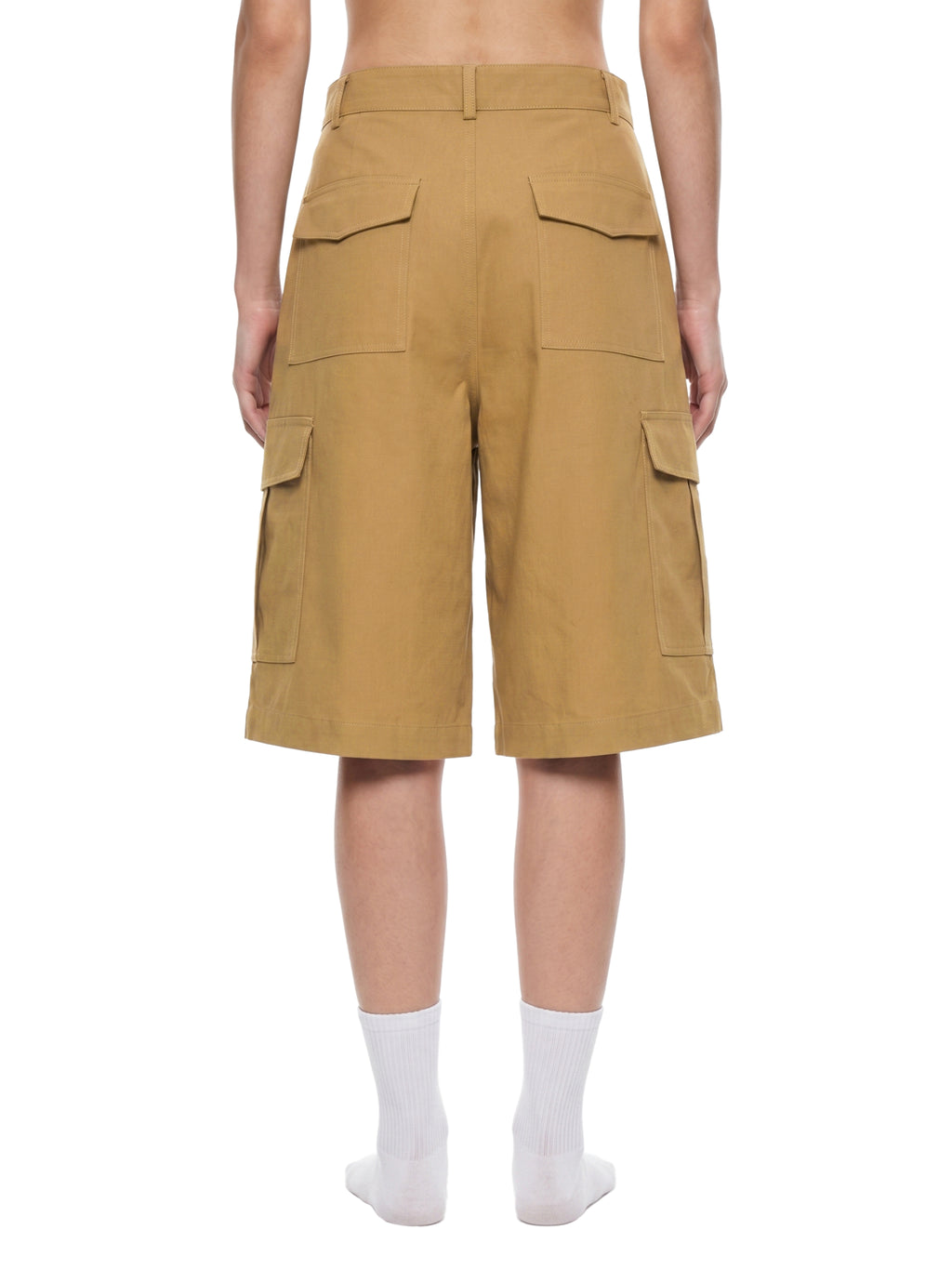 Brown cargo shorts worn by a person on a white background