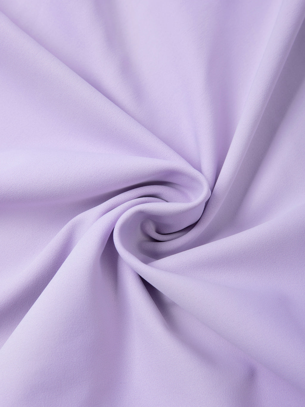 Close-up of light purple fabric with a swirl pattern