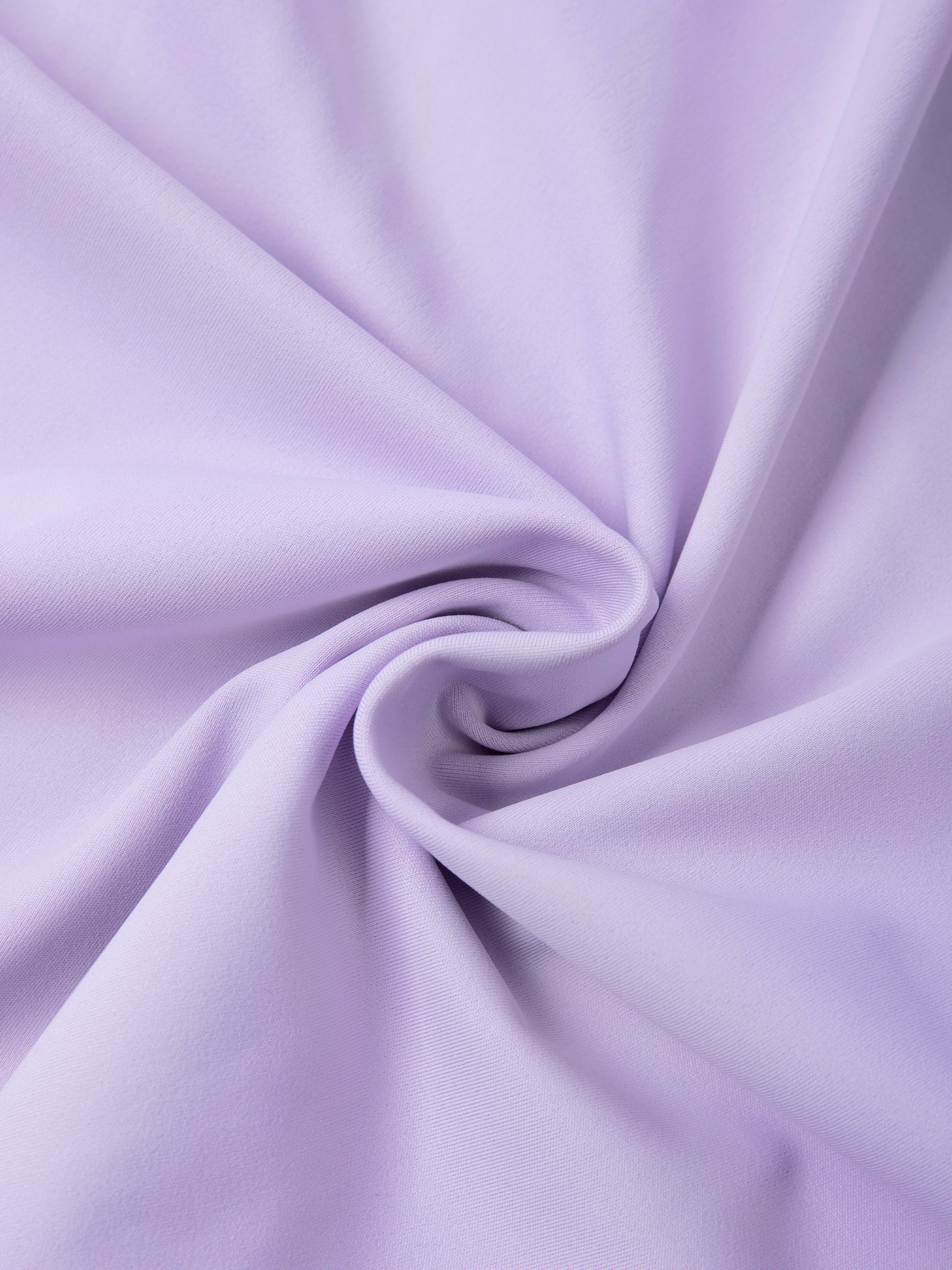 Close-up of light purple fabric with a swirl pattern