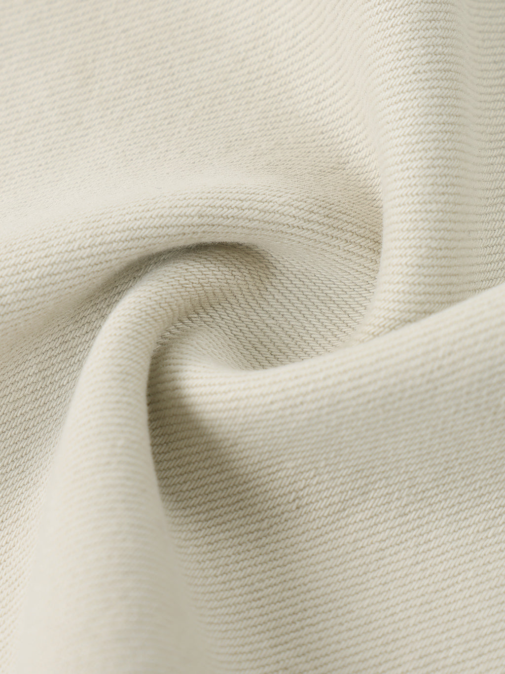 Close-up of beige fabric with a textured pattern