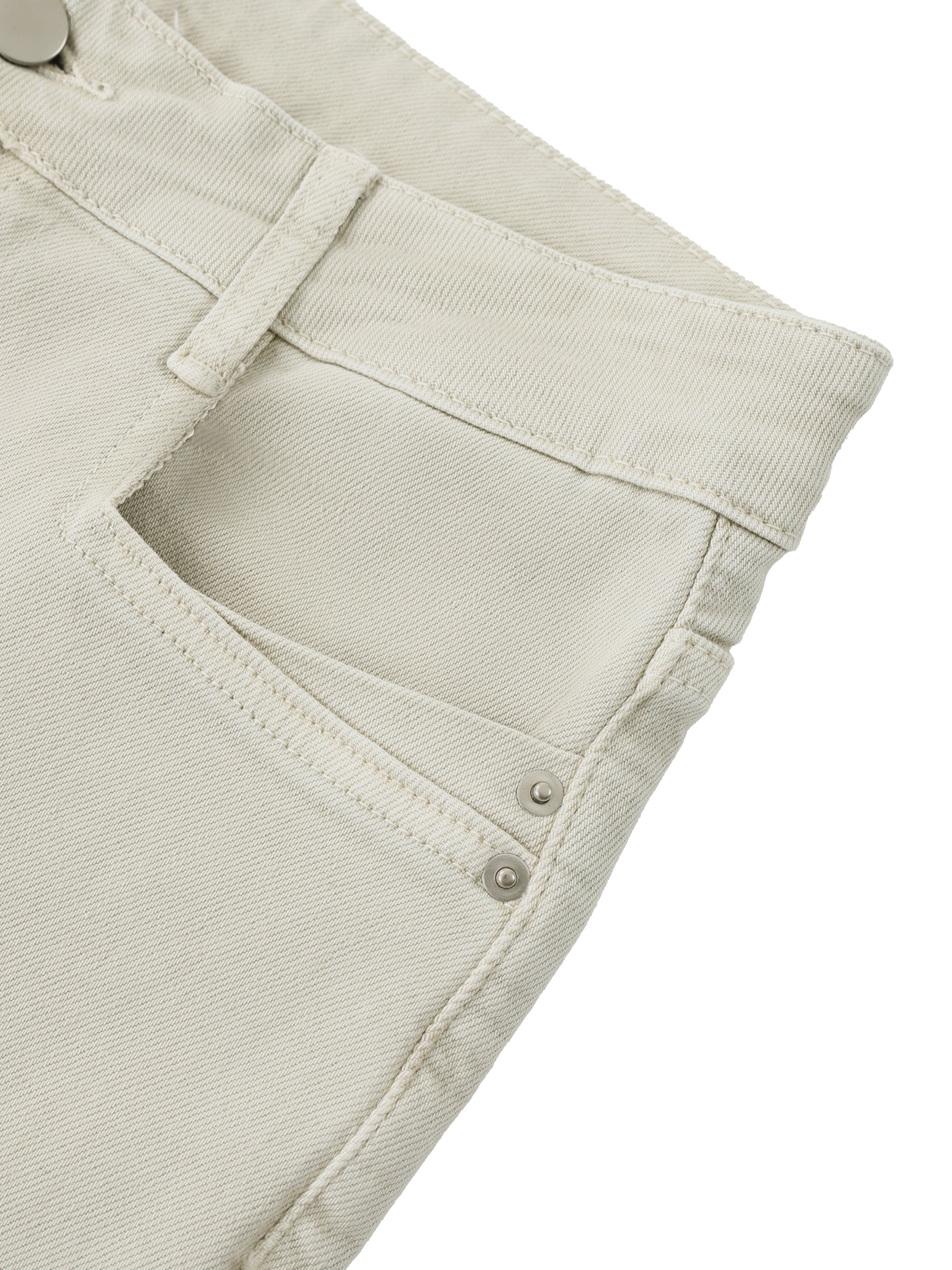 Close-up of beige pants with a pocket on a white background