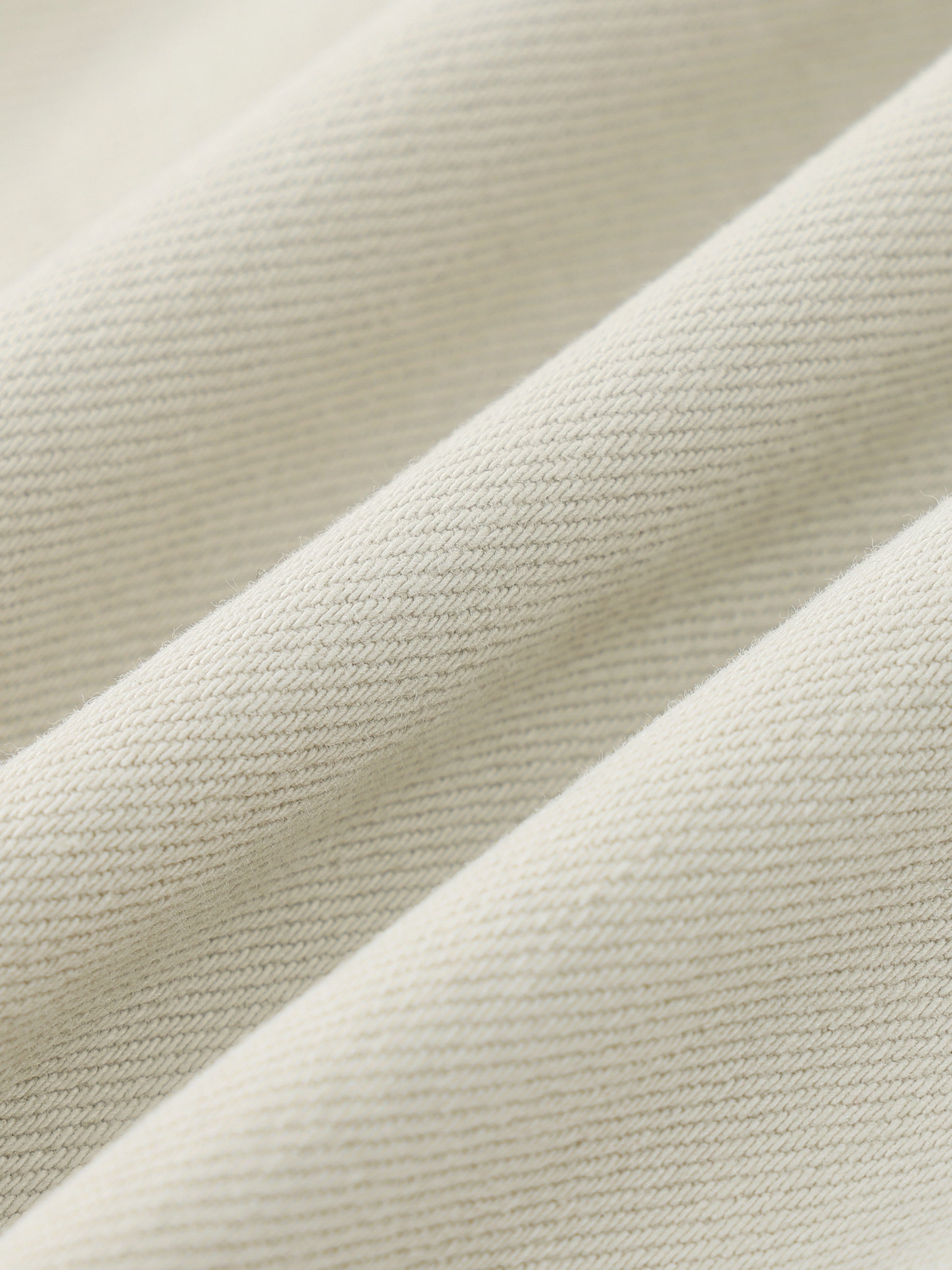 Close-up of beige fabric with a textured pattern