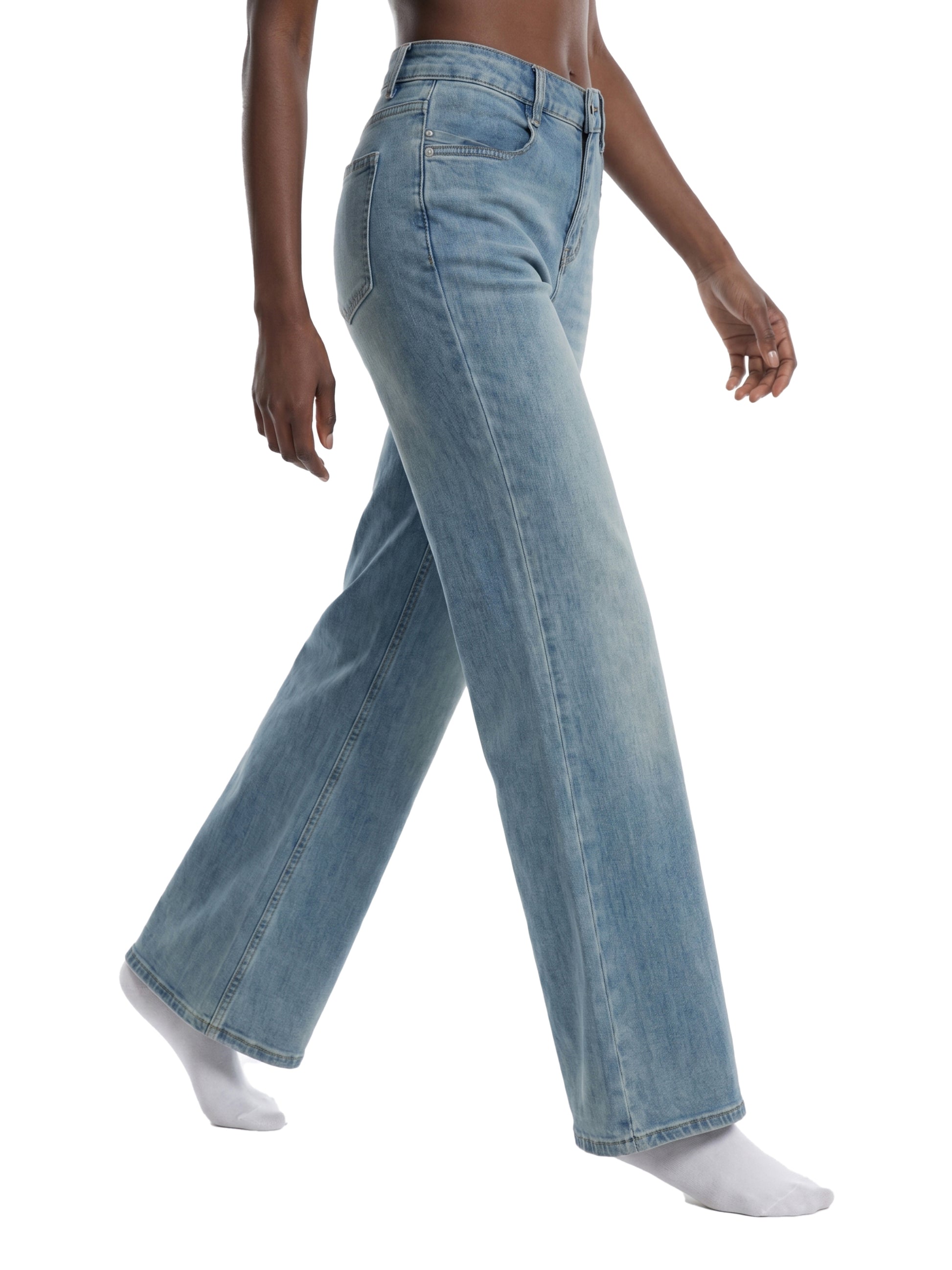 Light blue jeans worn by a person on a white background
