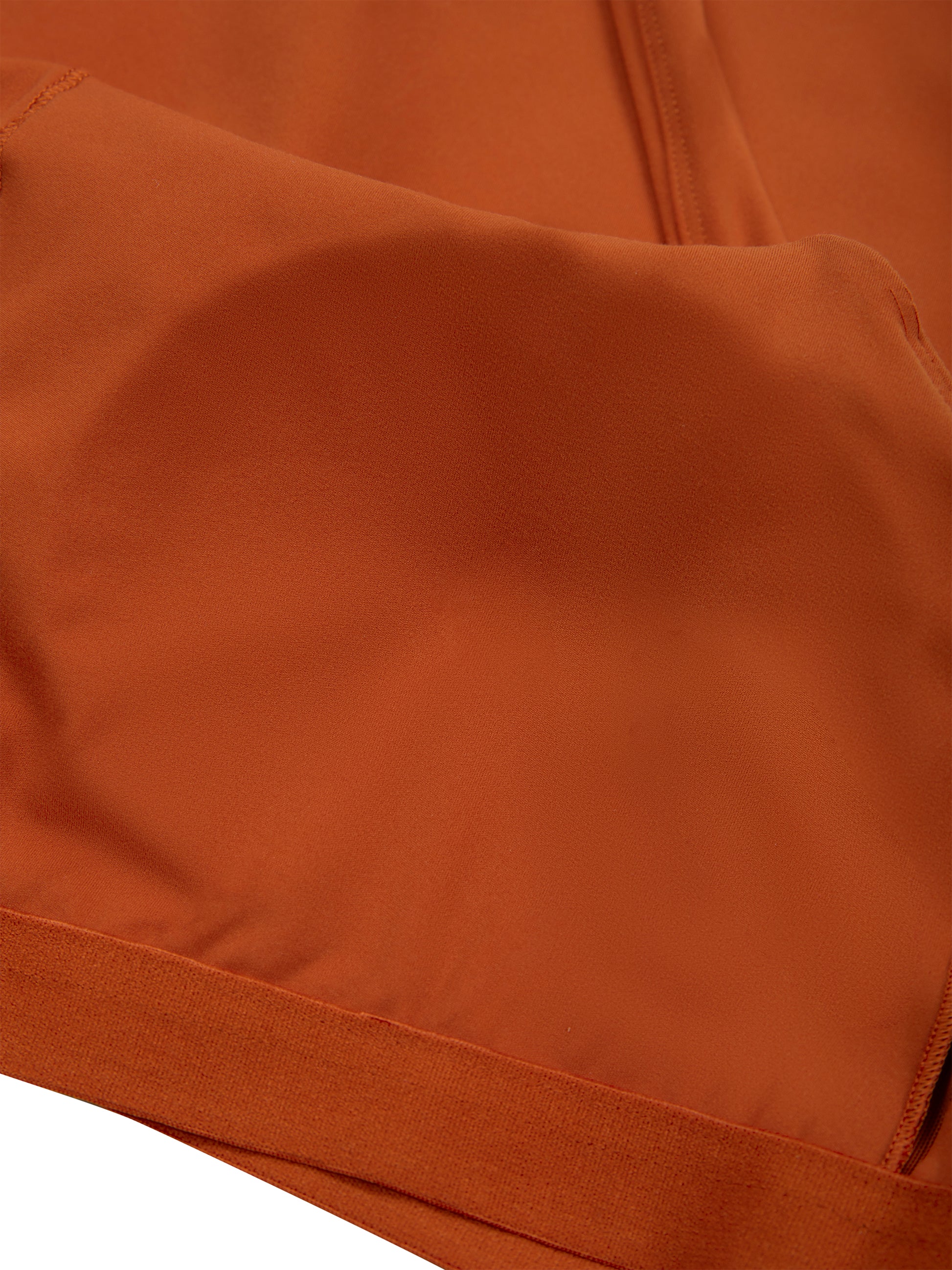 Close-up of brown fabric with a visible seam