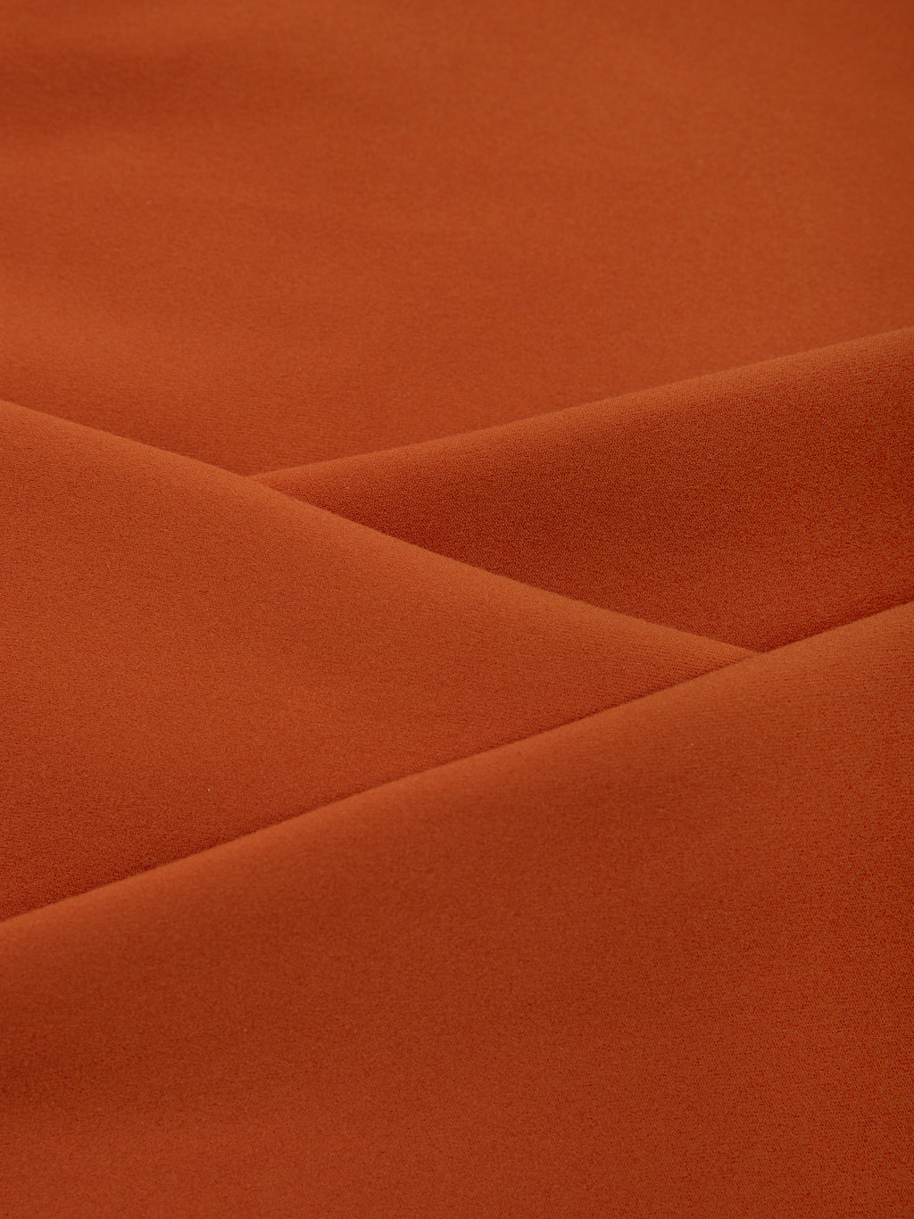 Close-up of brown fabric with folds
