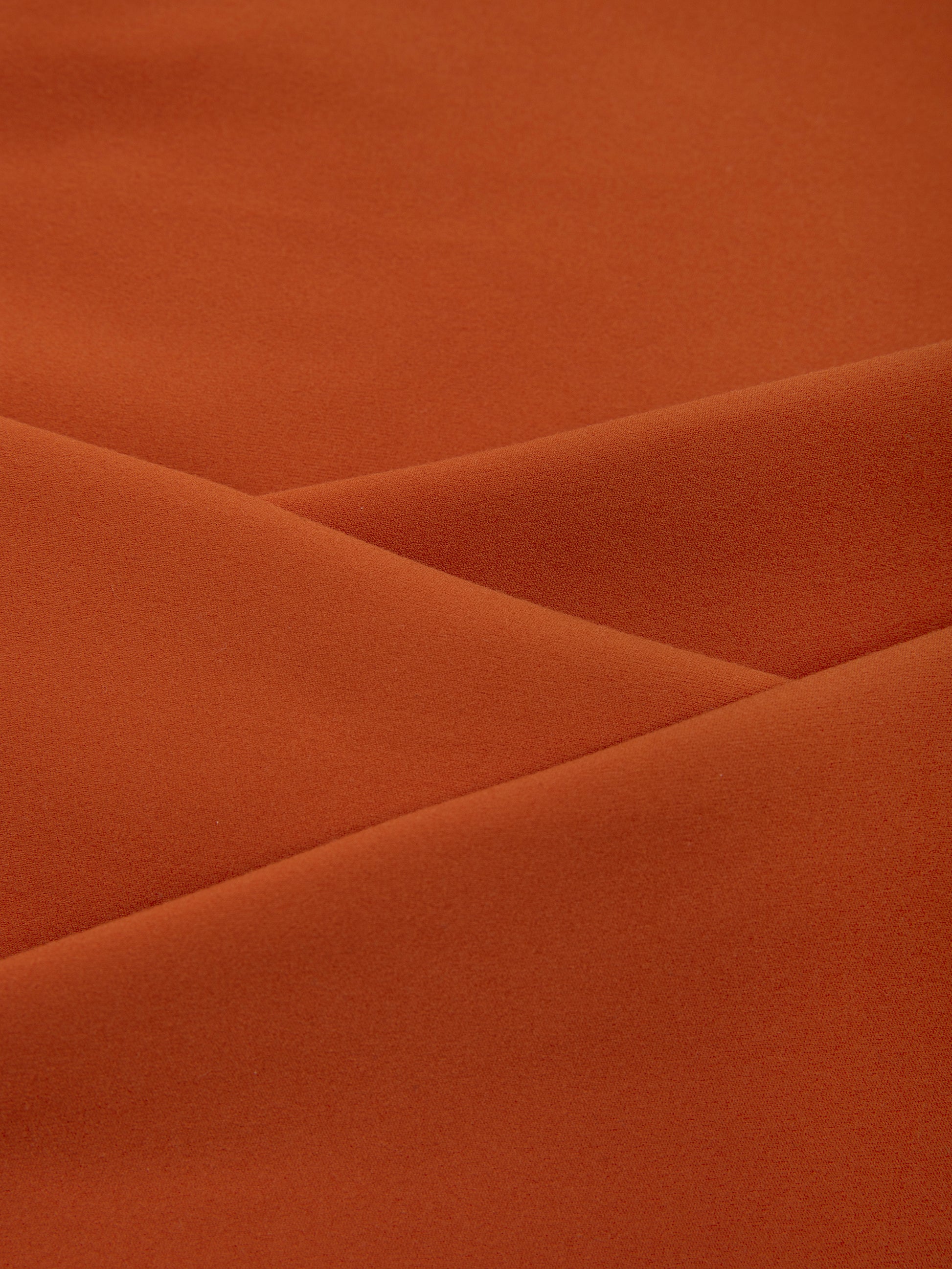 Close-up of brown fabric with folds